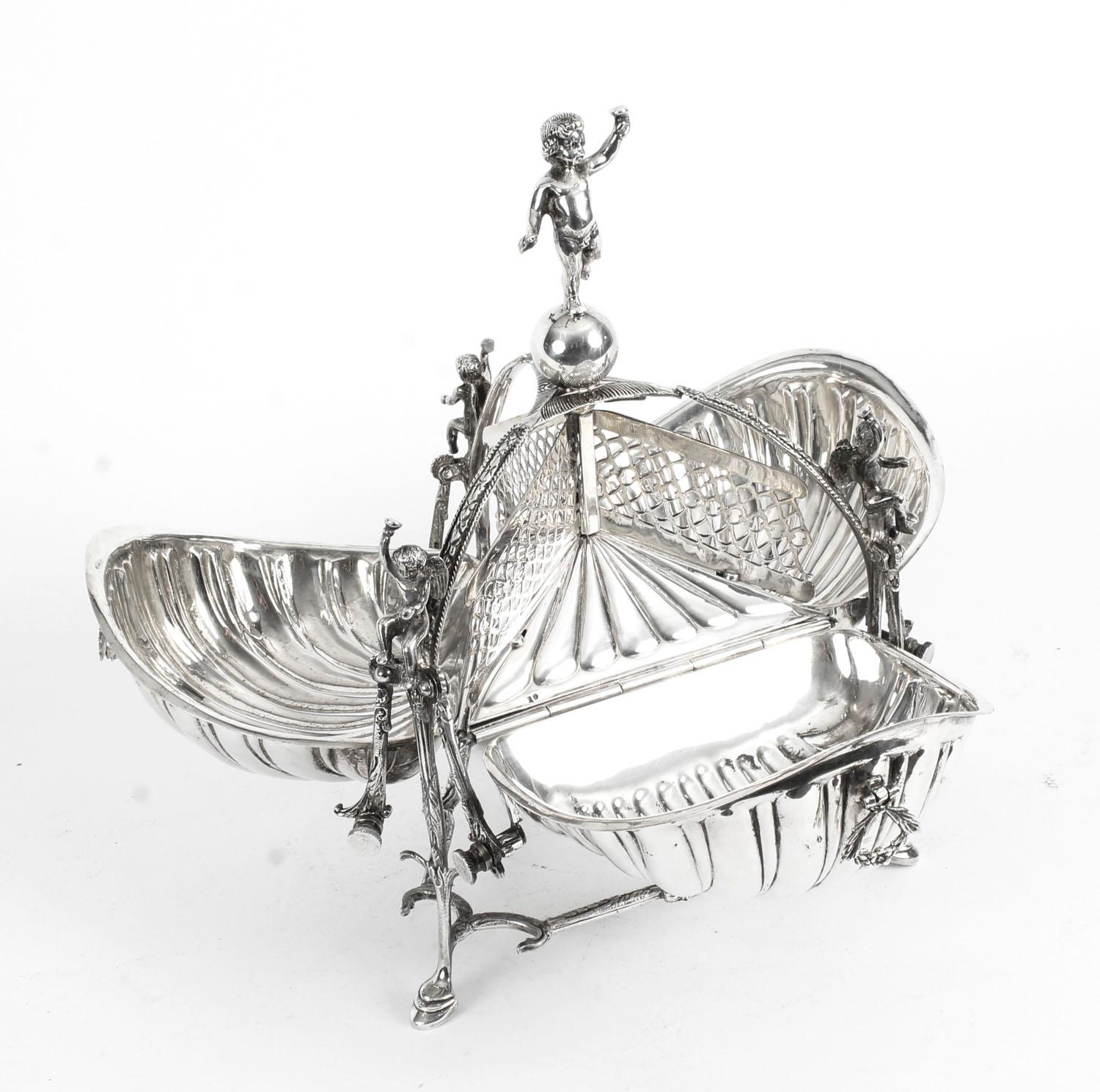 This is a beautiful antique triple shell shaped silver plated biscuit box, circa 1900 in date.

It bears the makers mark KR&S with a crown.

Producing this gorgeous piece over tea would be certain to raise a few eyebrows. You could use it to