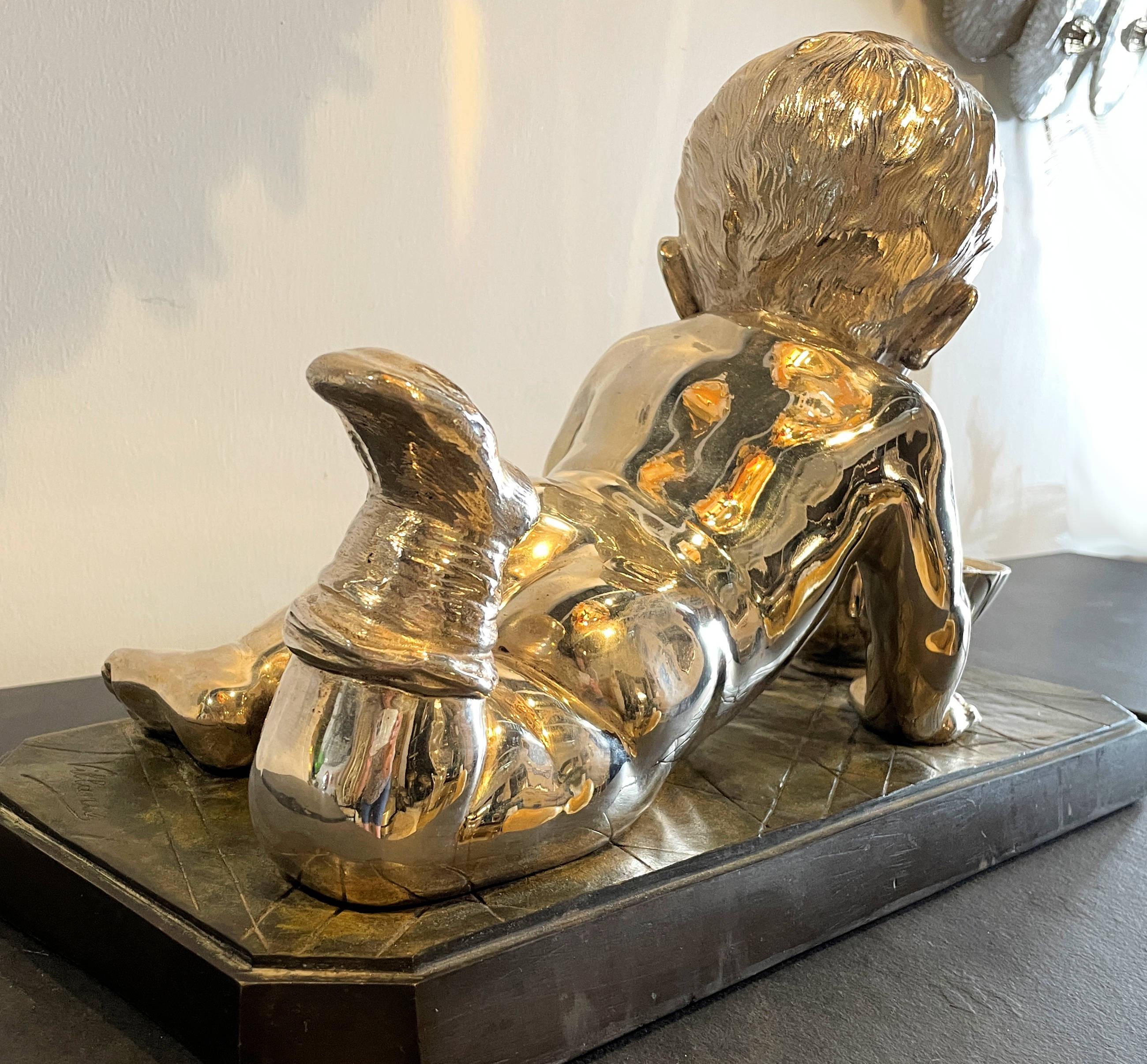 Art Nouveau Early 20th Century Silvered Bronze Enfant Jouant Avec Un Bateau For Sale