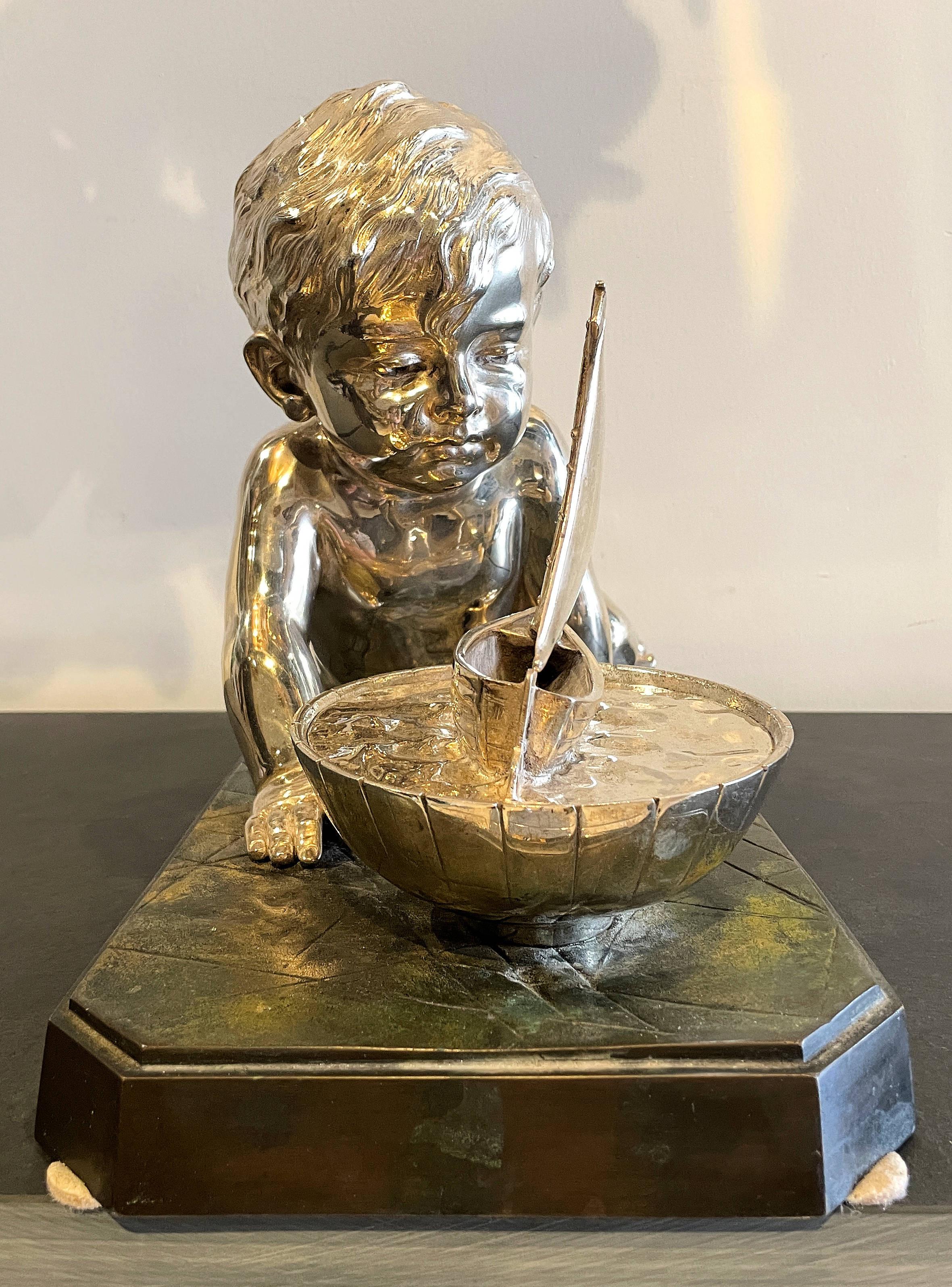 Cast Early 20th Century Silvered Bronze Enfant Jouant Avec Un Bateau For Sale