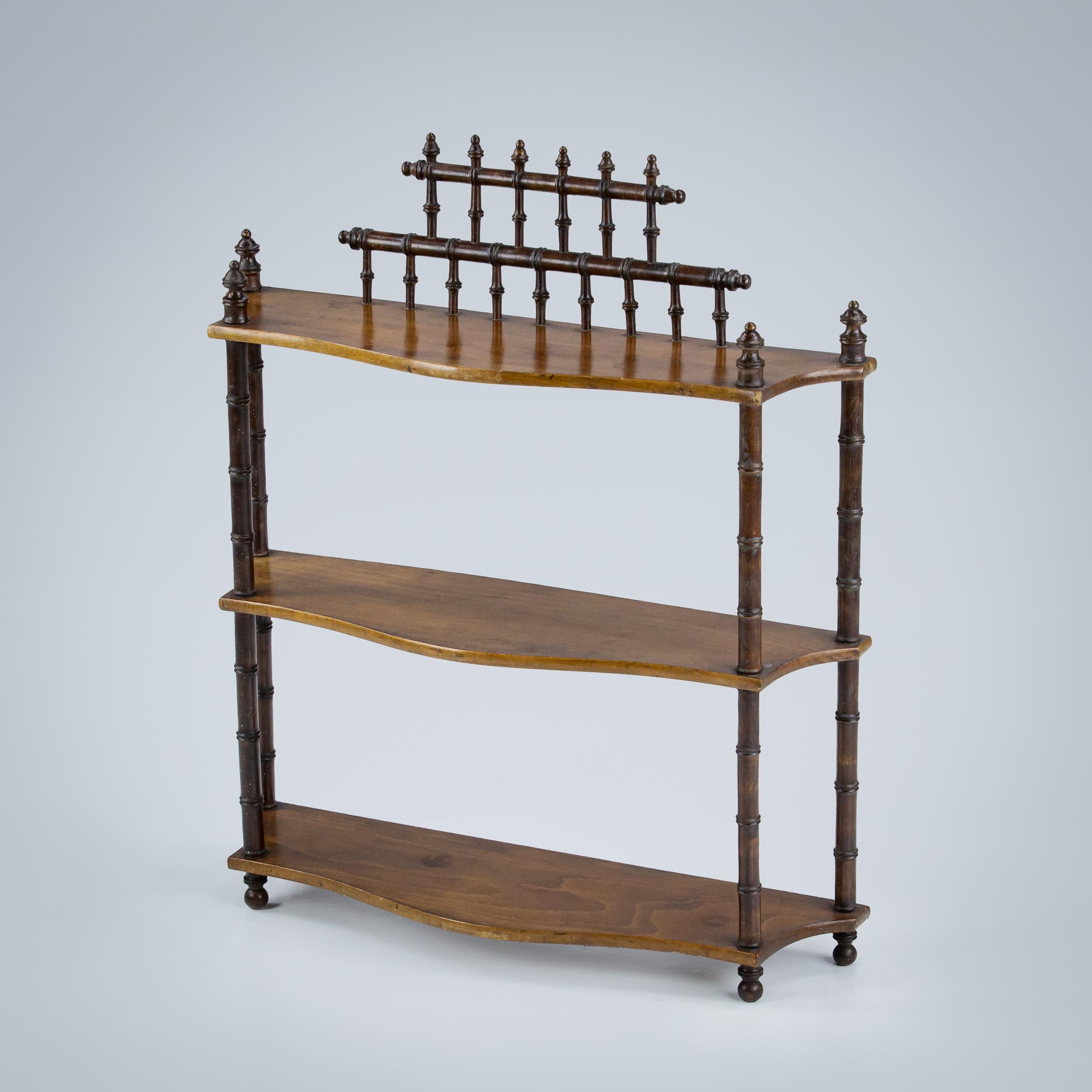 Early 20th Century simulated bamboo desktop or wall hanging shelf, serpentine shelves. Excellent condition and patination. France Circa 1900
