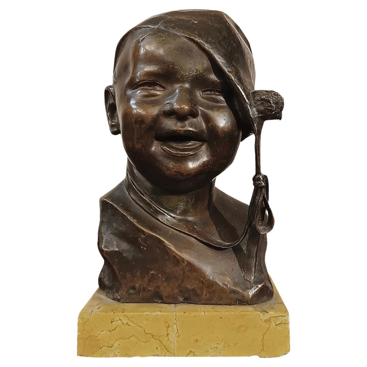 EARLY 20th CENTURY SMALL BRONZE CHILD WITH CAP BY P. PIRAINO