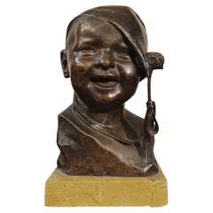EARLY 20th CENTURY SMALL BRONZE CHILD WITH CAP BY P. PIRAINO
