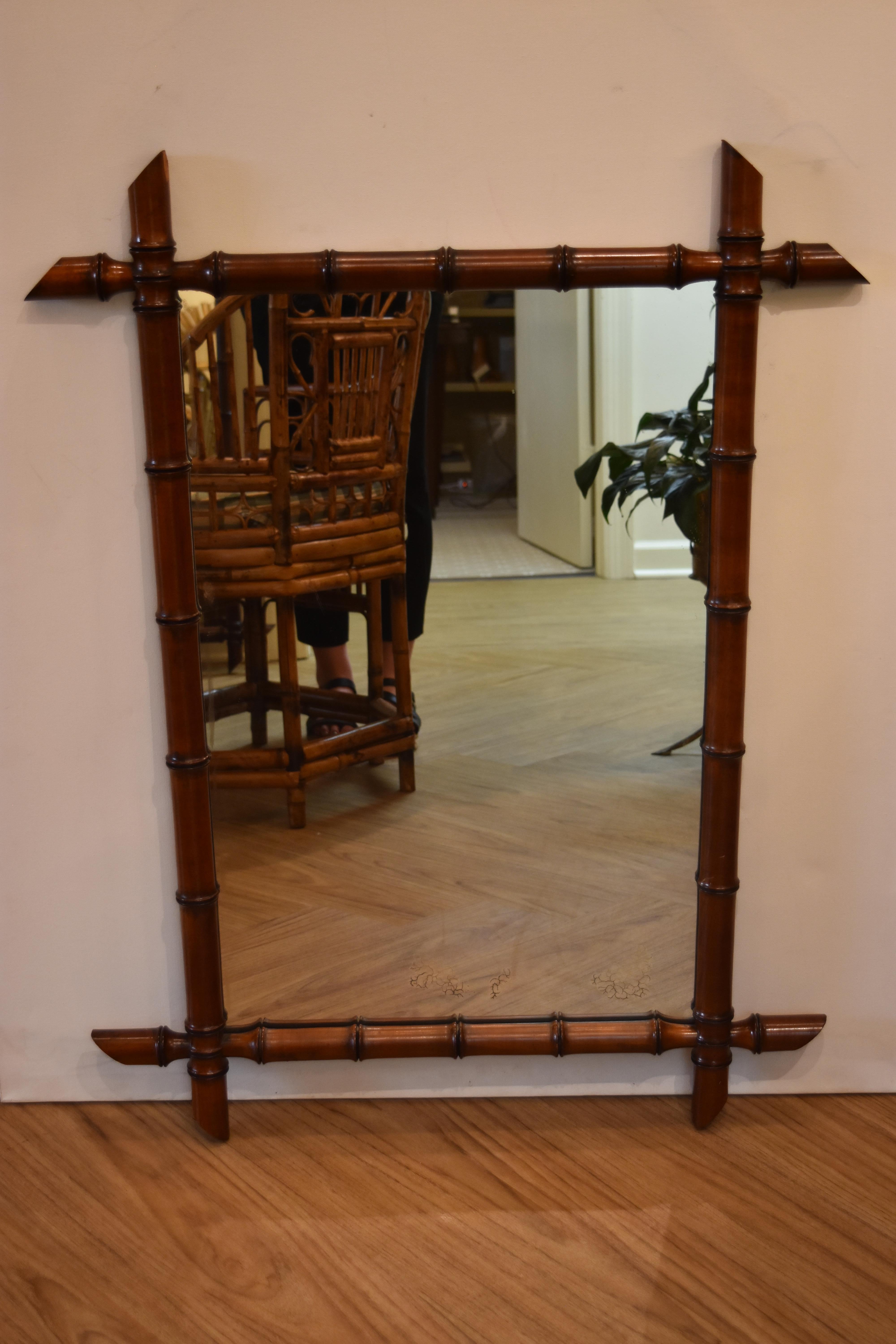 This small French faux bamboo mirror has a wonderful dark finish and the original old back.