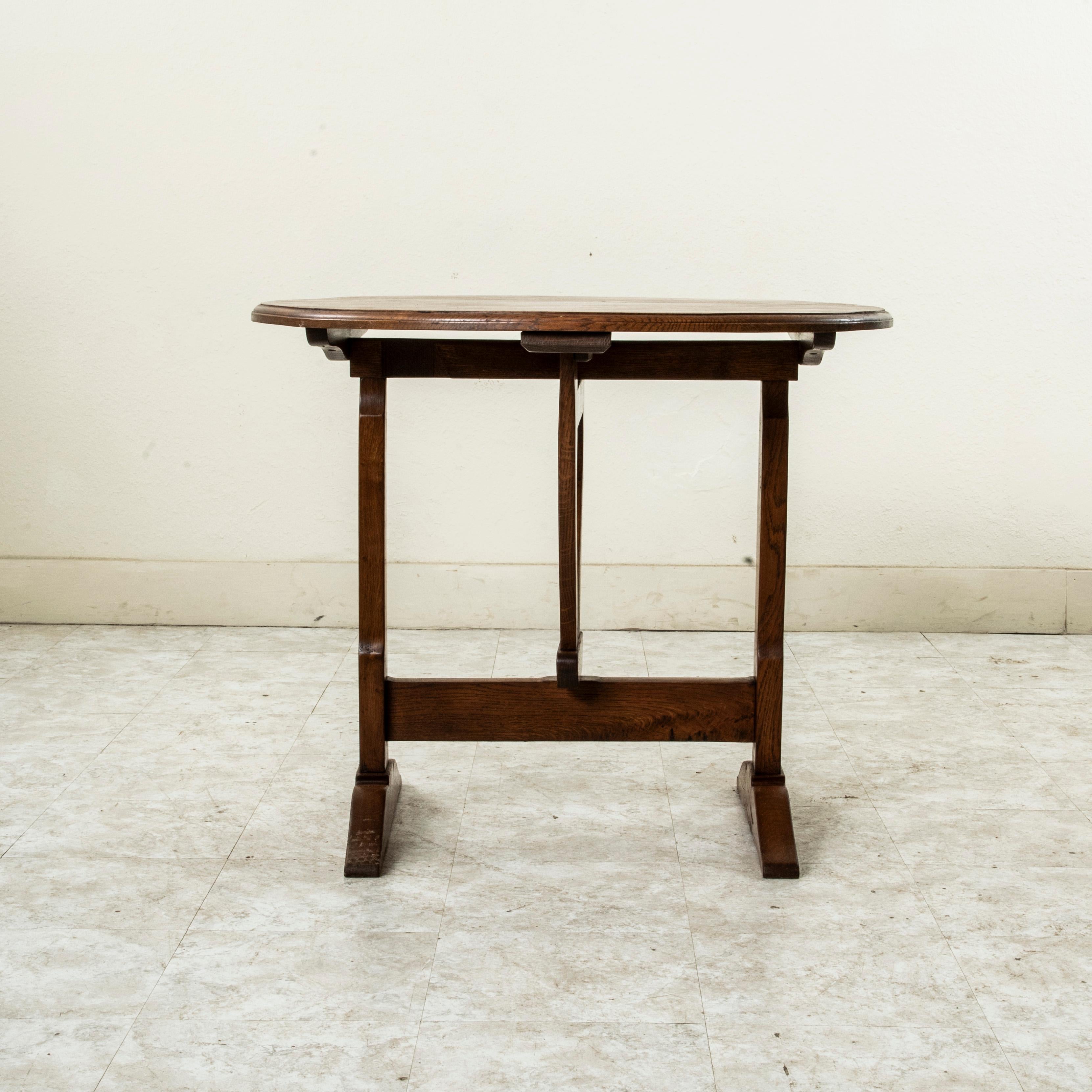 A perfect piece to finish a wine cellar or bar area, this small scale hand pegged oak vineyard table was originally used for wine tasting in the wine cellar of a vintner or for carrying out to the vineyards for the grape pickers to eat lunch.