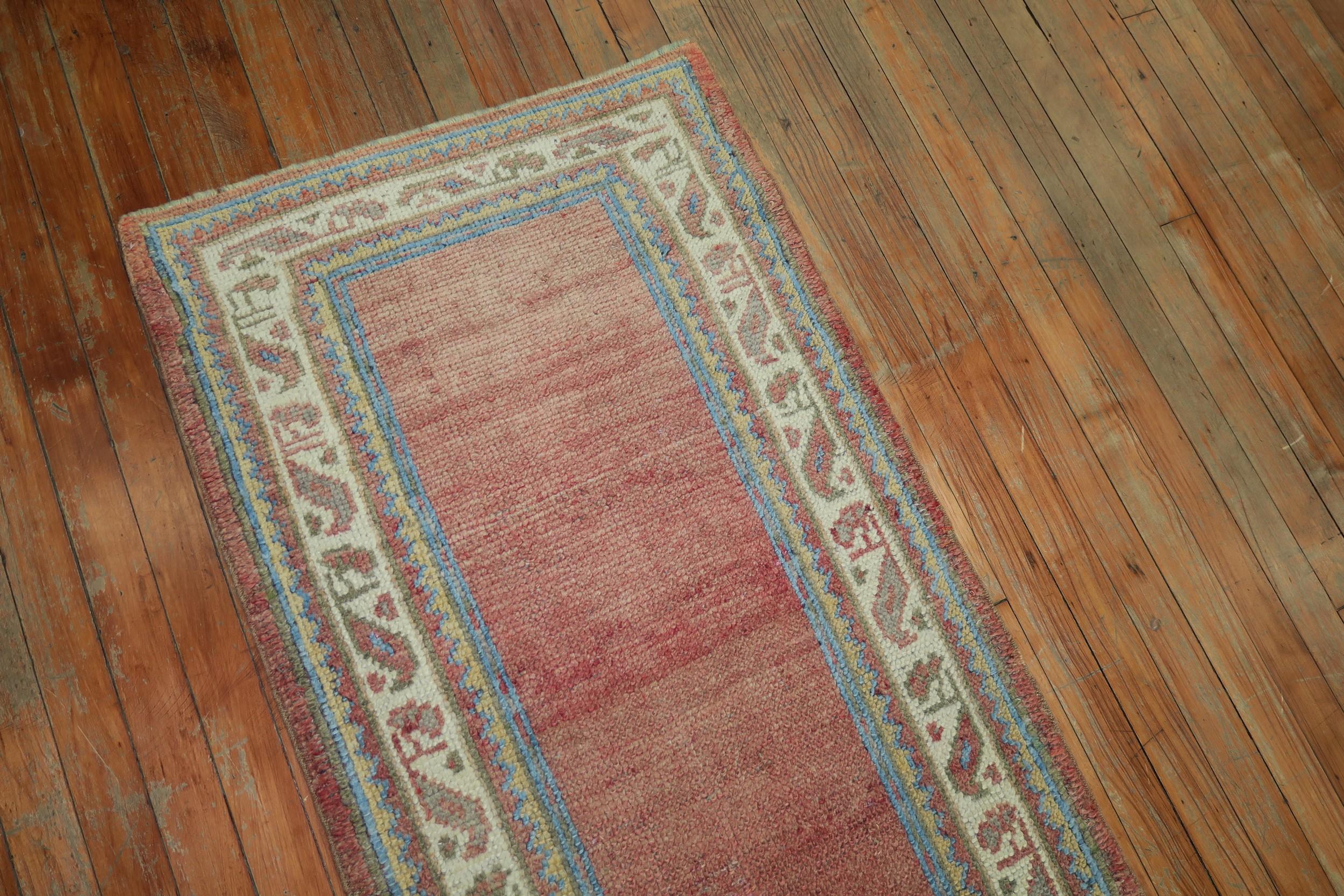 Early 20th Century Soft Red Antique Turkish Oushak Wool Narrow Runner In Good Condition In New York, NY