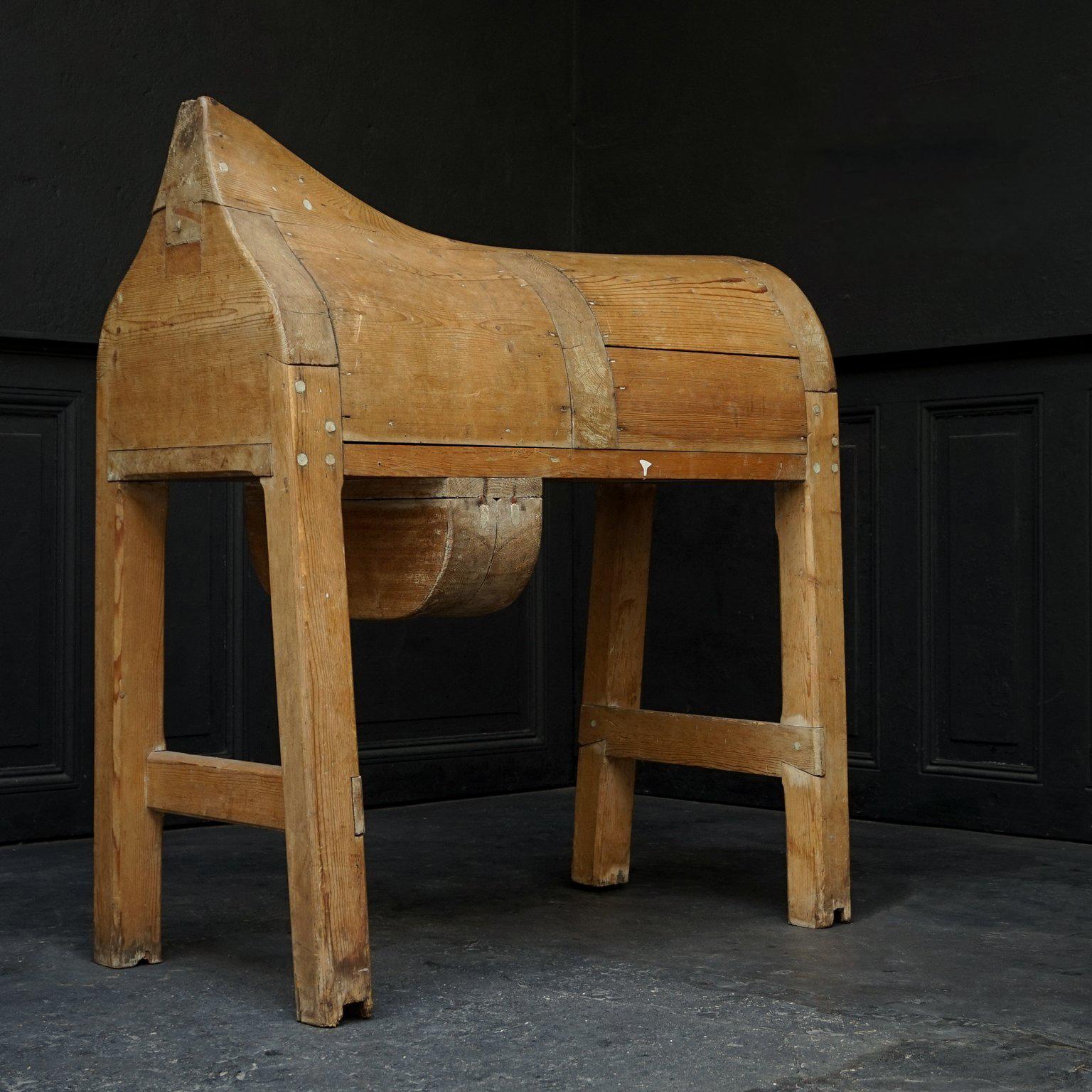 An original pinewood horseback saddle stand.

The wood has nice natural wear and signs of use, lovely colour and patina. Visible craftsmanship constructions on the woodwork. 
It's obviously been used in a horse stable but now it would also be a