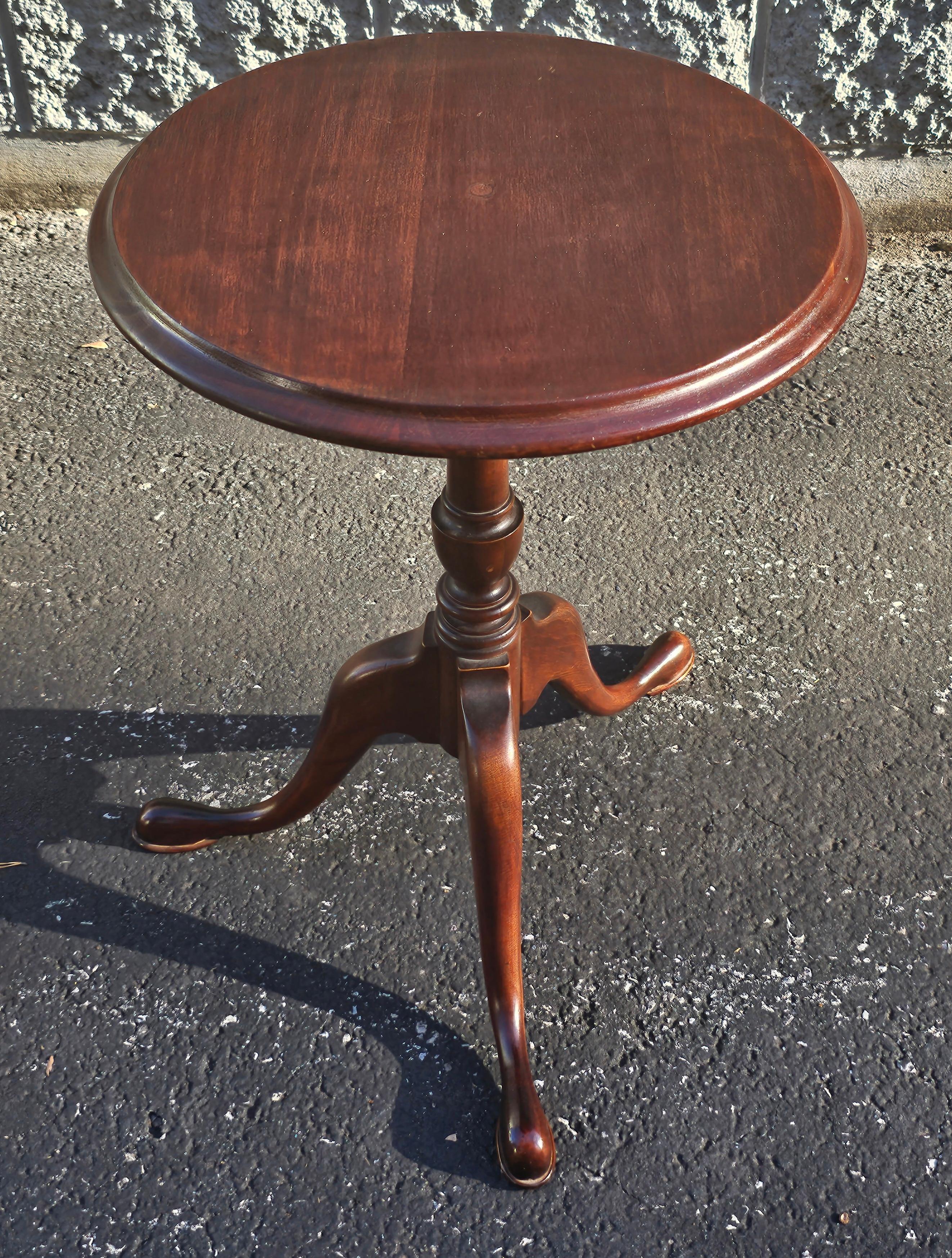 An Early 20th Century Refinished Solid Cherry Pedestal Tripod Candle Stand with Snake Feet. 
Measures 16