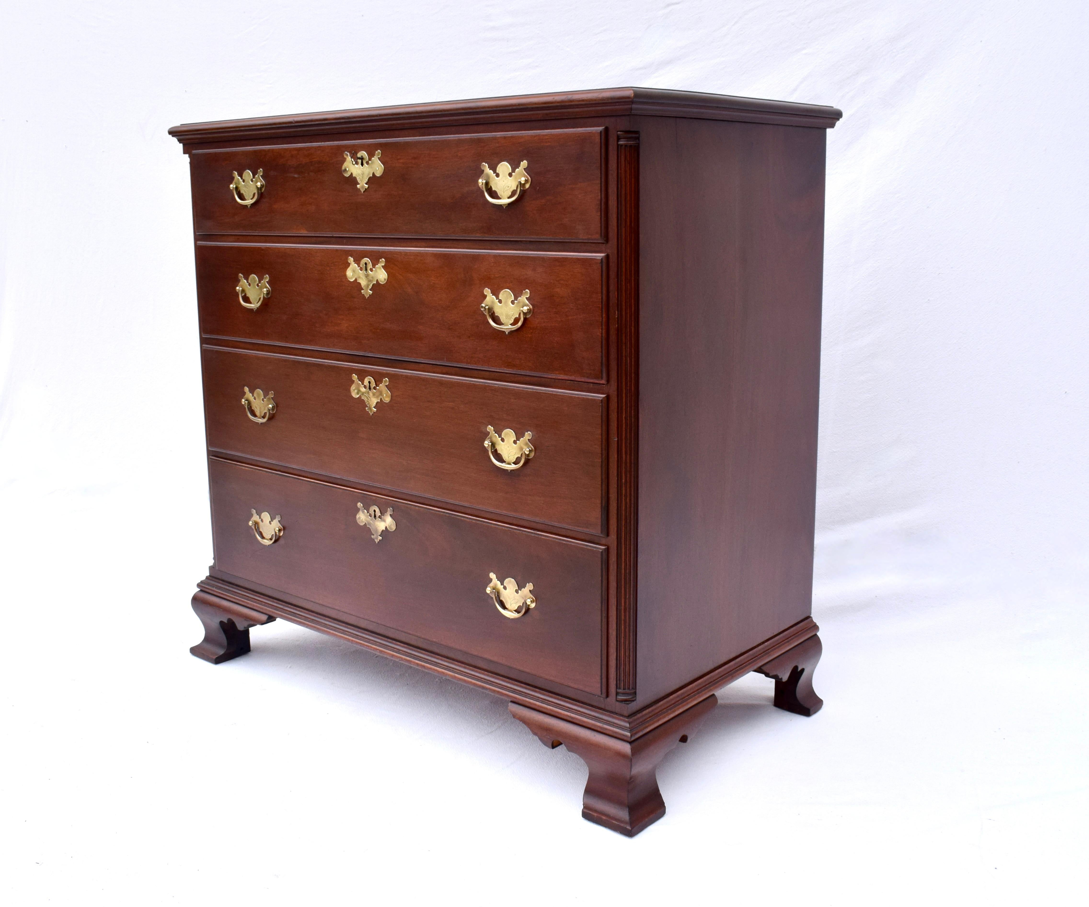 An exceptional early 20th Century solid Mahogany Chippendale style dresser chest of drawers with working locks & key. Beautifully maintained original finish enhanced with replaced antique hand etched brasses boasting corner reed columns, generous