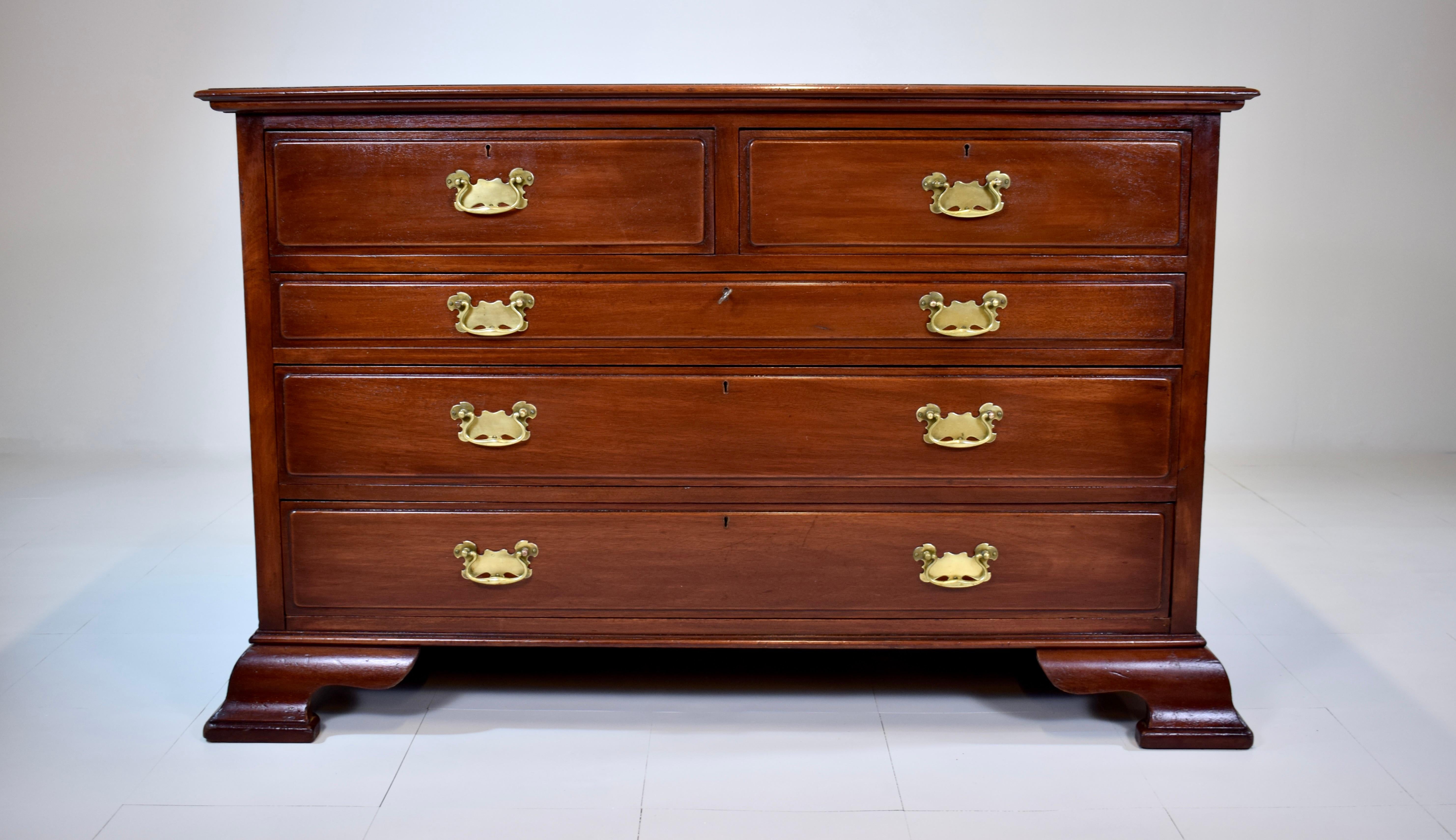 An exceptional early 20th Century solid Mahogany Chippendale style dresser chest of drawers with working locks & key. Newly refinished with hand polished original brasses boasting generous storage in the five dovetailed drawers; resting on gorgeous