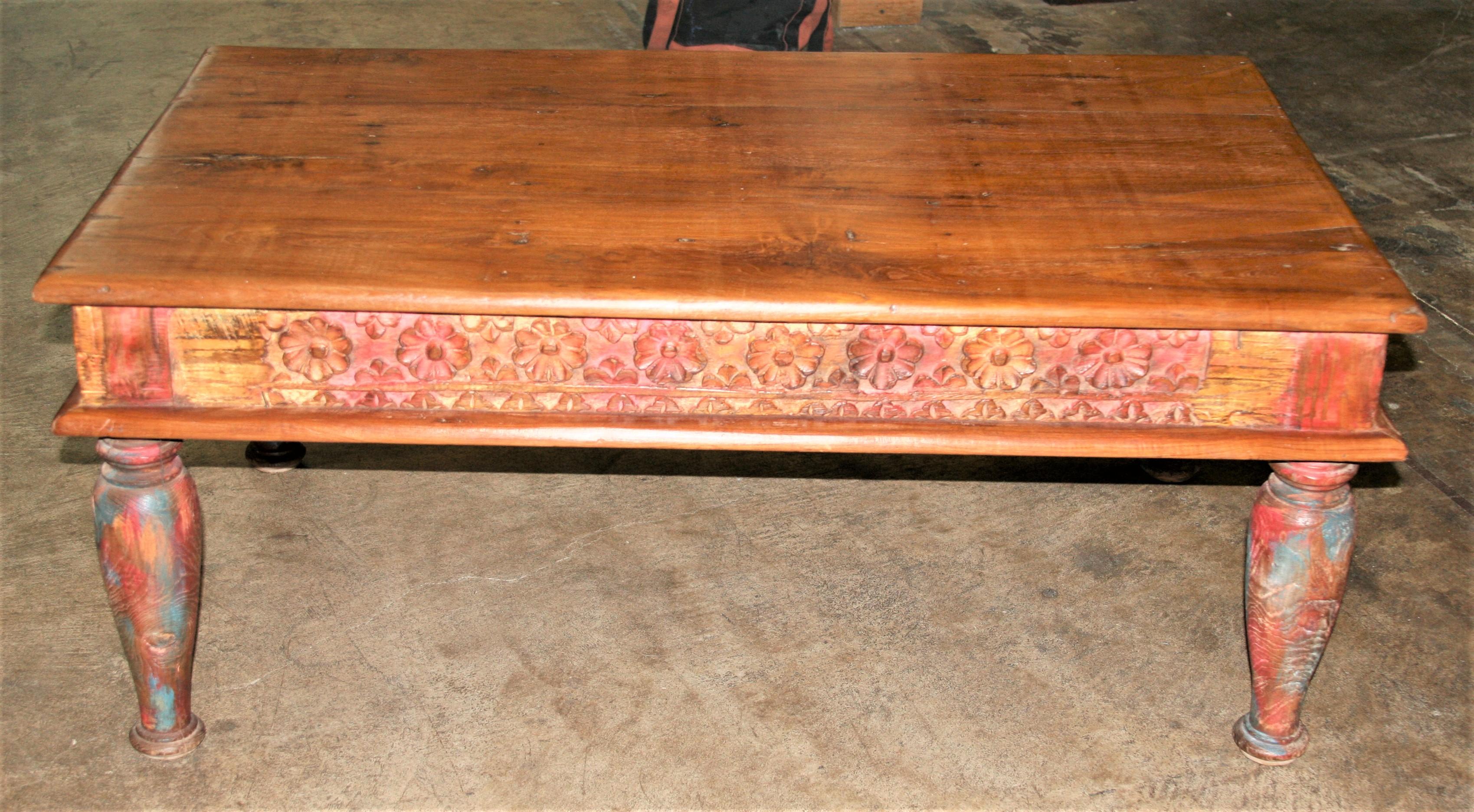 This table comes from a tea plantation owned by the British settlers in Asia in the 20th century. It is superbly crafted in the old word style with original painting still sticking in most part of the table. The sides are carved in floral design