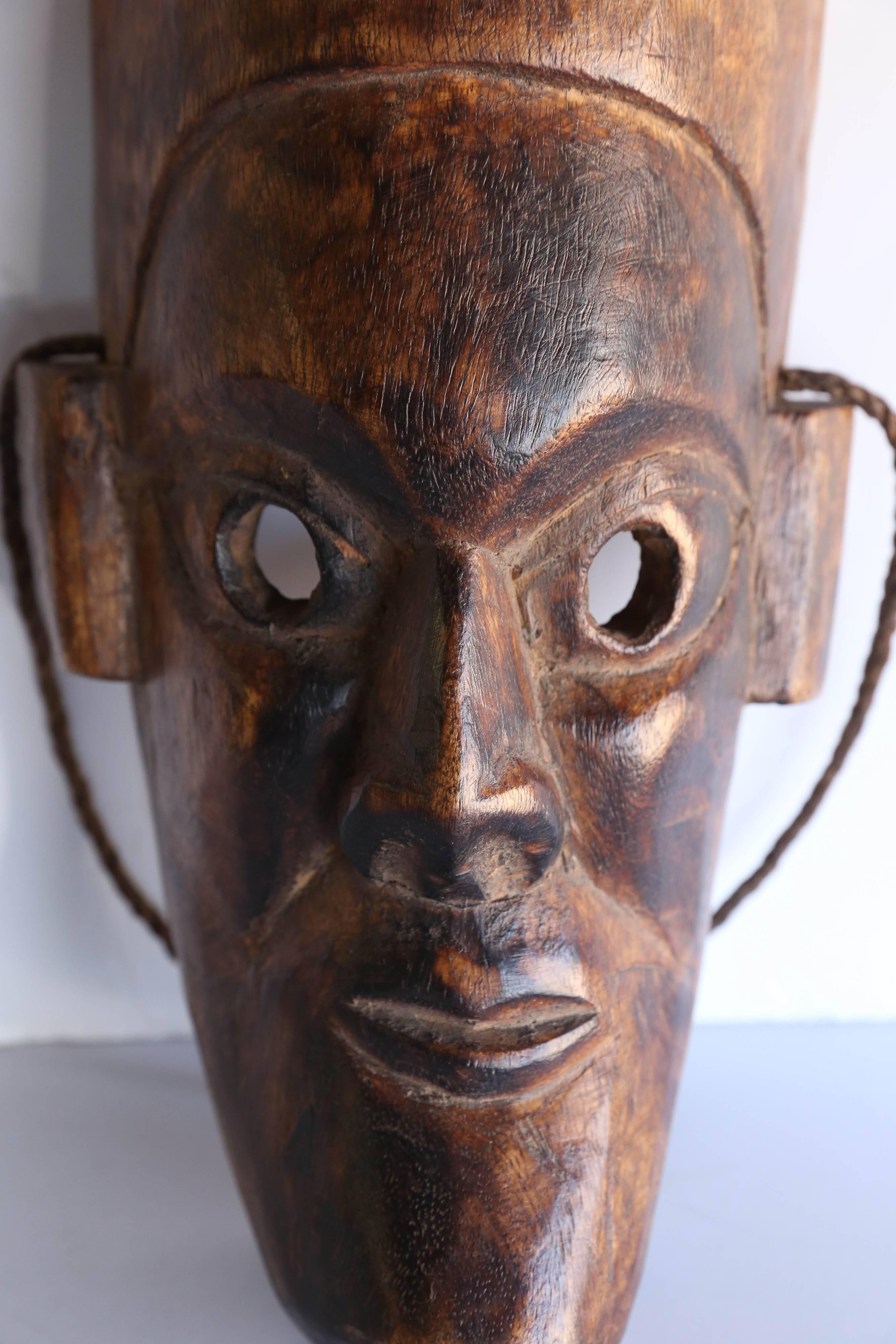 This mask was hand-carved from one block of solid hard wood. It comes from the Himalayan kingdom of Nepal.
During festivals the people wear the masks and march in procession on the streets.