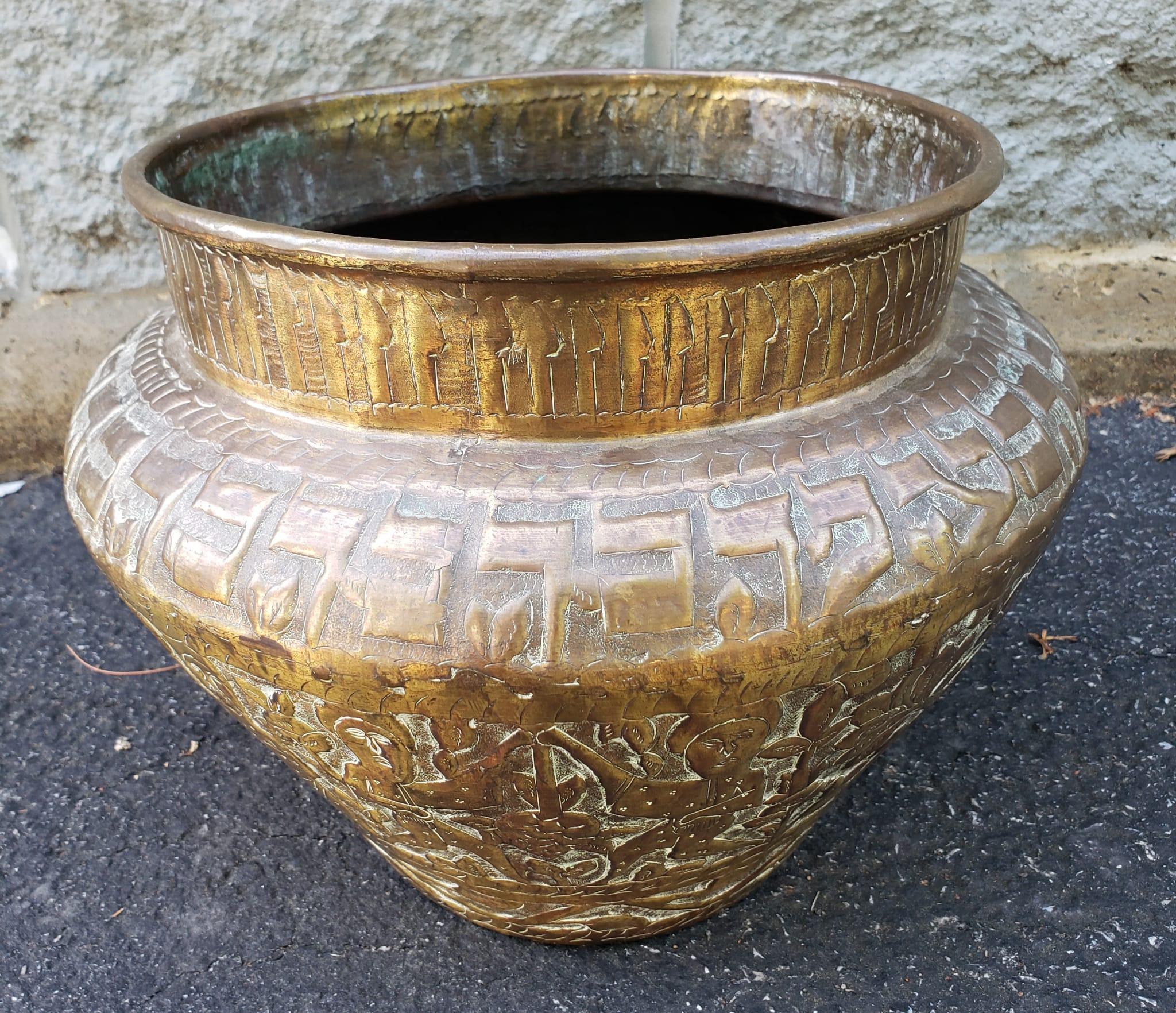 An early 20th Southeast Asian hammered and Embossed Brass Jardinière. Artistically embossed with a large variety of scenes. Check out all the pictures. Measures 13