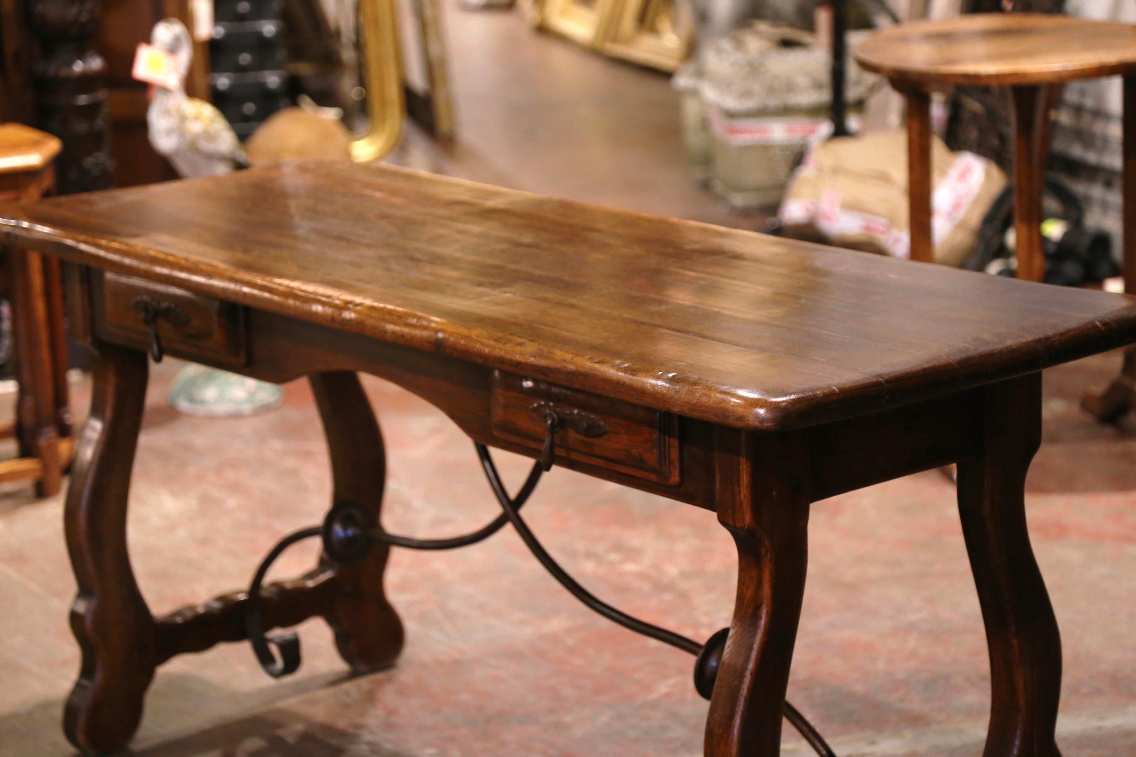 Hand-Carved Early 20th Century Spanish Carved Oak Writing Table Desk with Iron Stretcher
