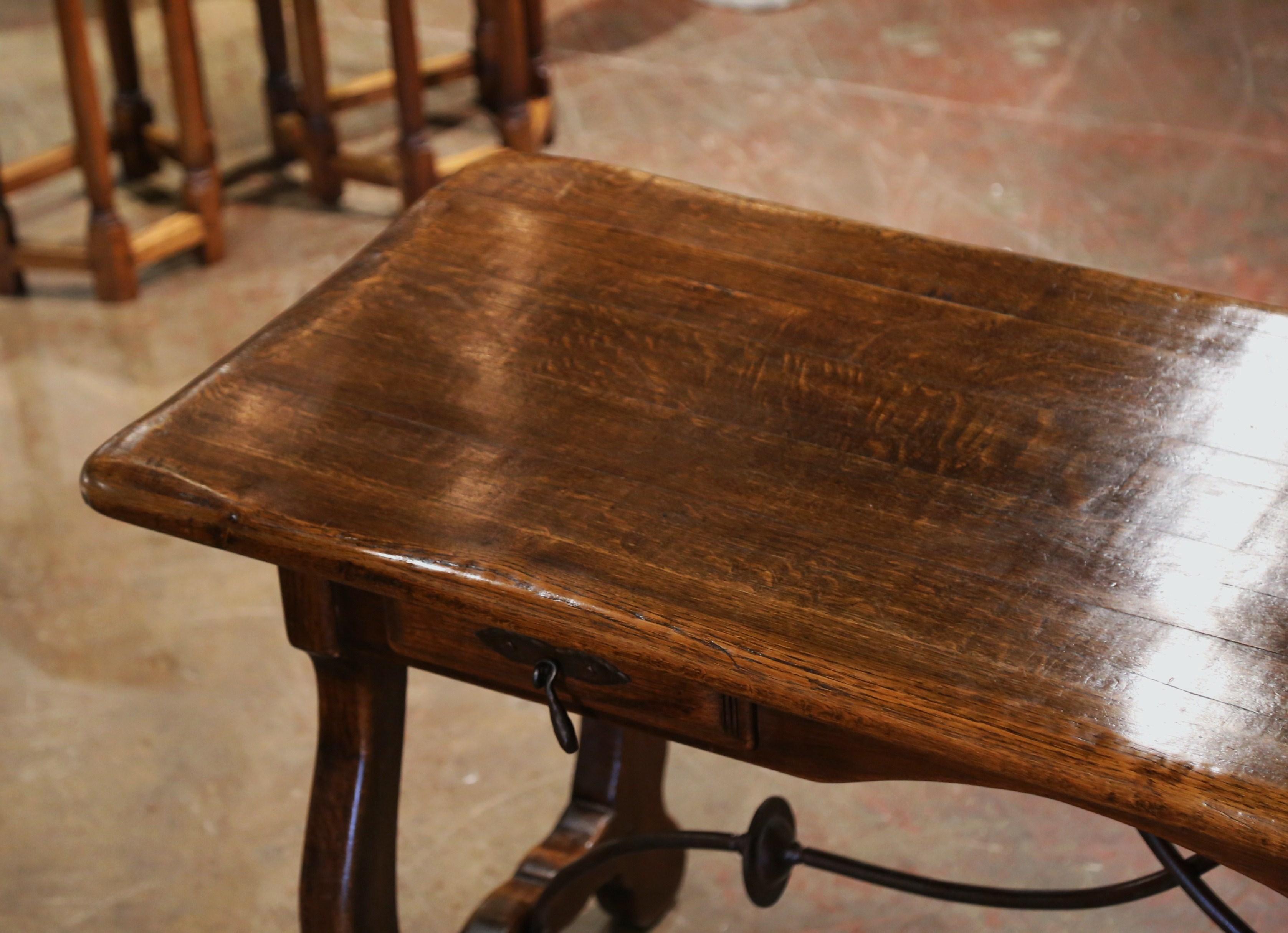 Early 20th Century Spanish Carved Oak Writing Table Desk with Iron Stretcher In Excellent Condition In Dallas, TX