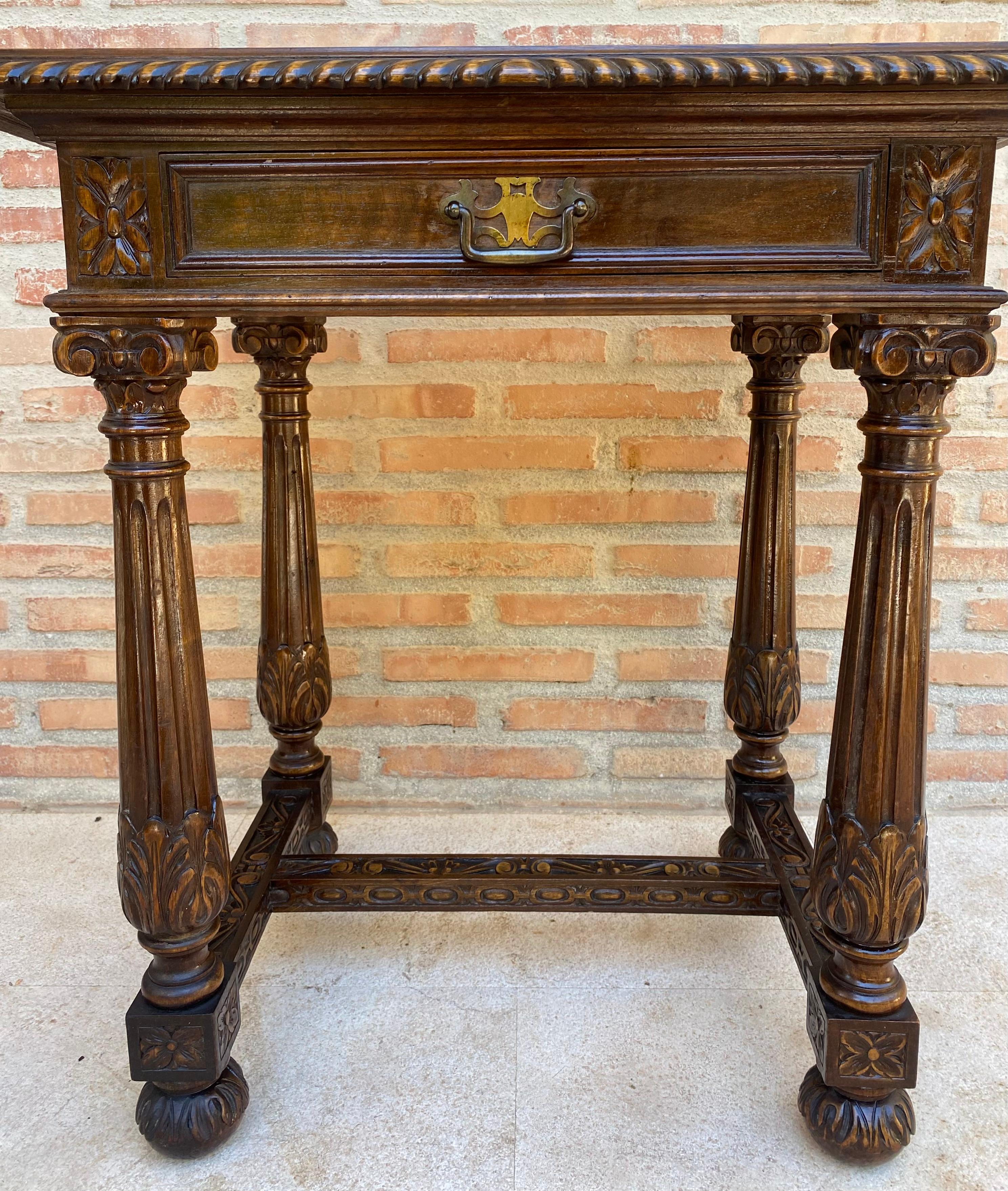 Early 20th Century Spanish Carved Walnut Side Table with One Drawer, 1940s
Spanish side table from the early 20th century with a drawer and iron fittings.
Beautiful table that you can use as a night table or side tables, auxiliary table for table