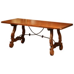 Early 20th Century Spanish Carved Walnut Trestle Table and Forged Iron Stretcher