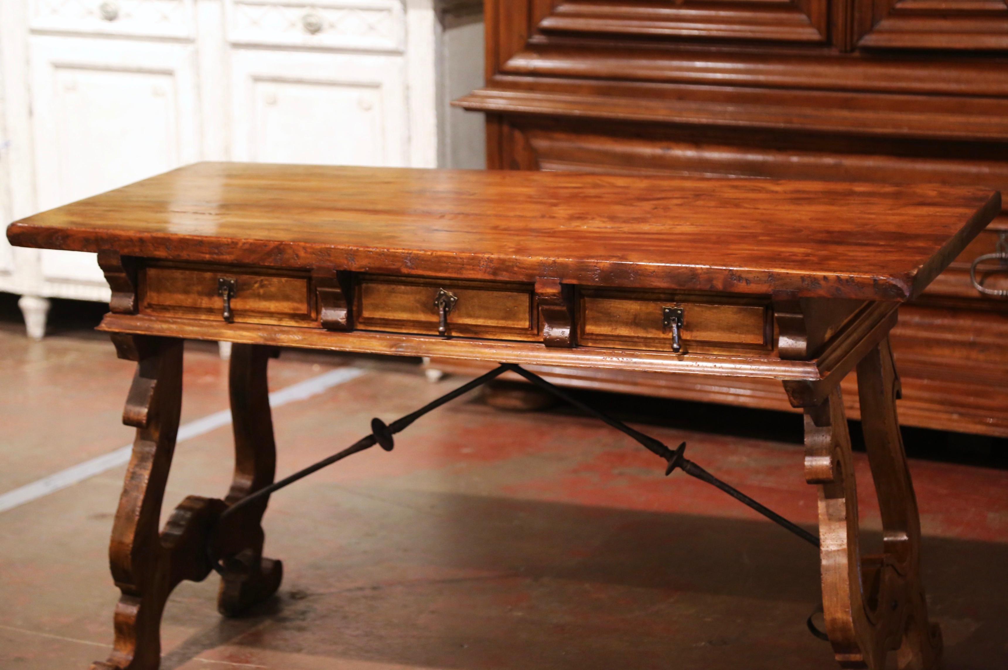 Hand-Carved Early 20th Century Spanish Carved Walnut Writing Table Desk with Iron Stretcher
