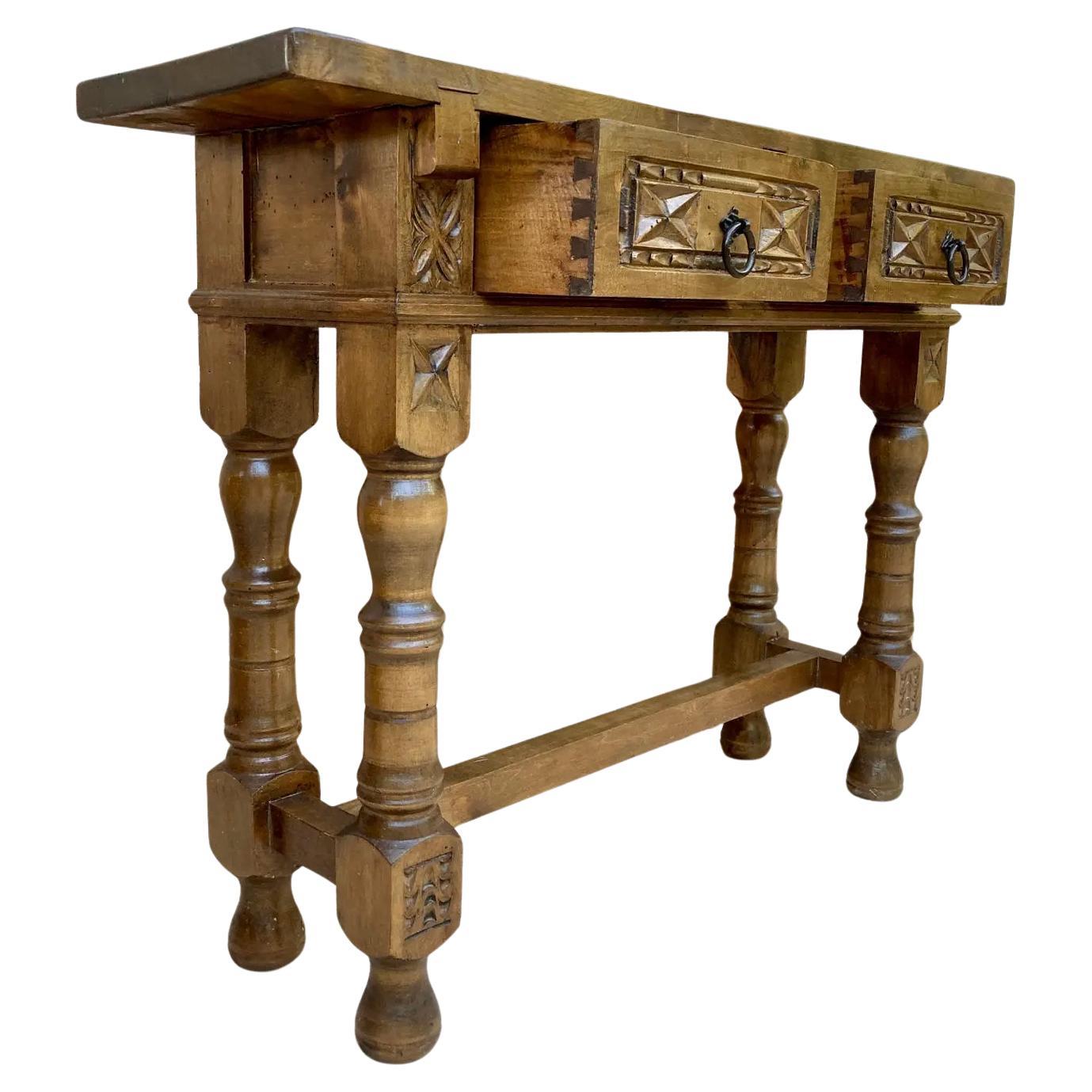Vintage Design
This characterful table is of rare narrow depth of 11in. It is characteristic of Spanish Baroque furniture with a thick single piece top, simple bold chip carved ornament and bold turnings. It has a rich lustrous patina. The thick