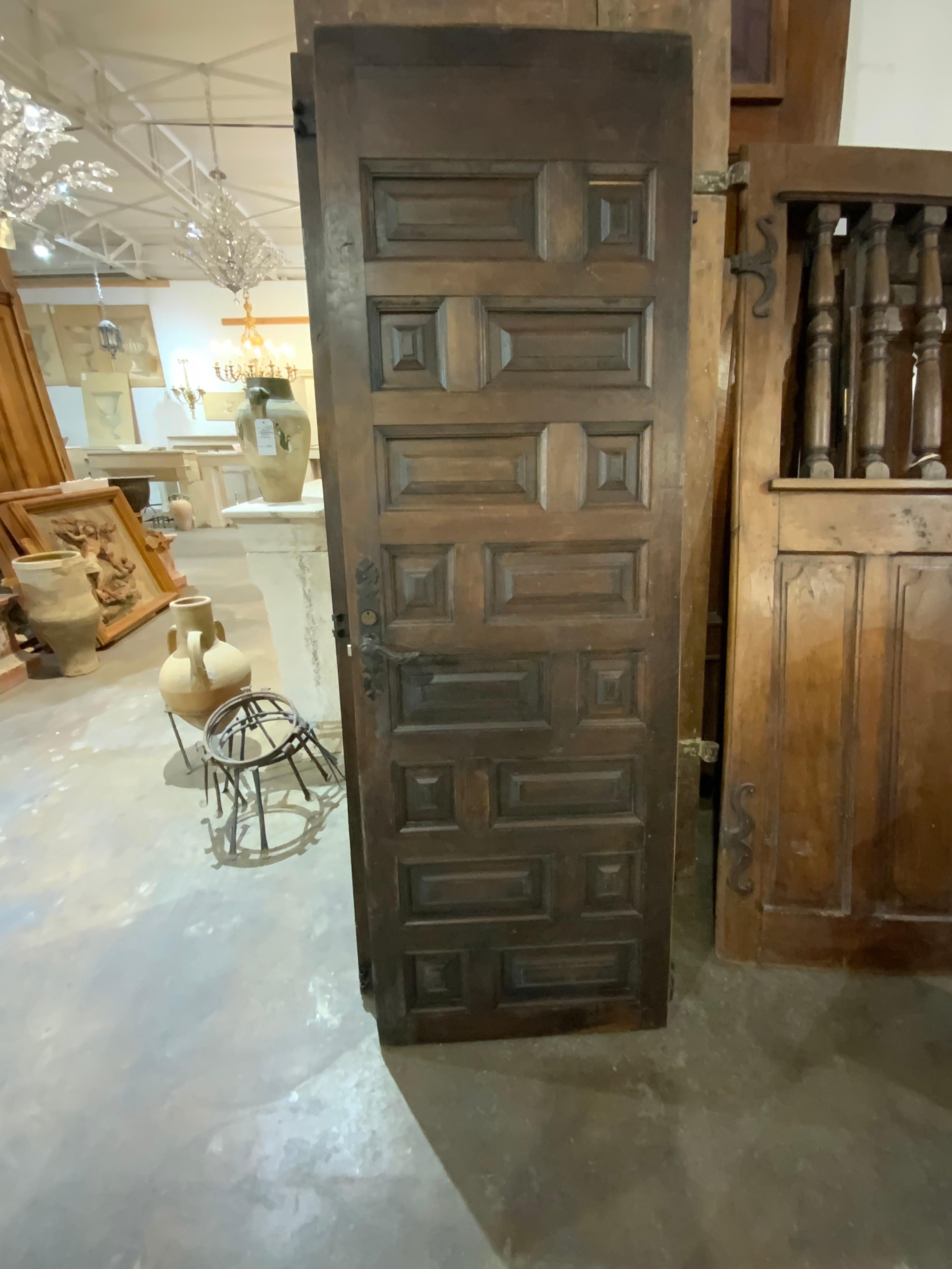 This Spanish door dates back to the 1910s. Item is made of oak and contains original lock and hardware. Origin; Spain.