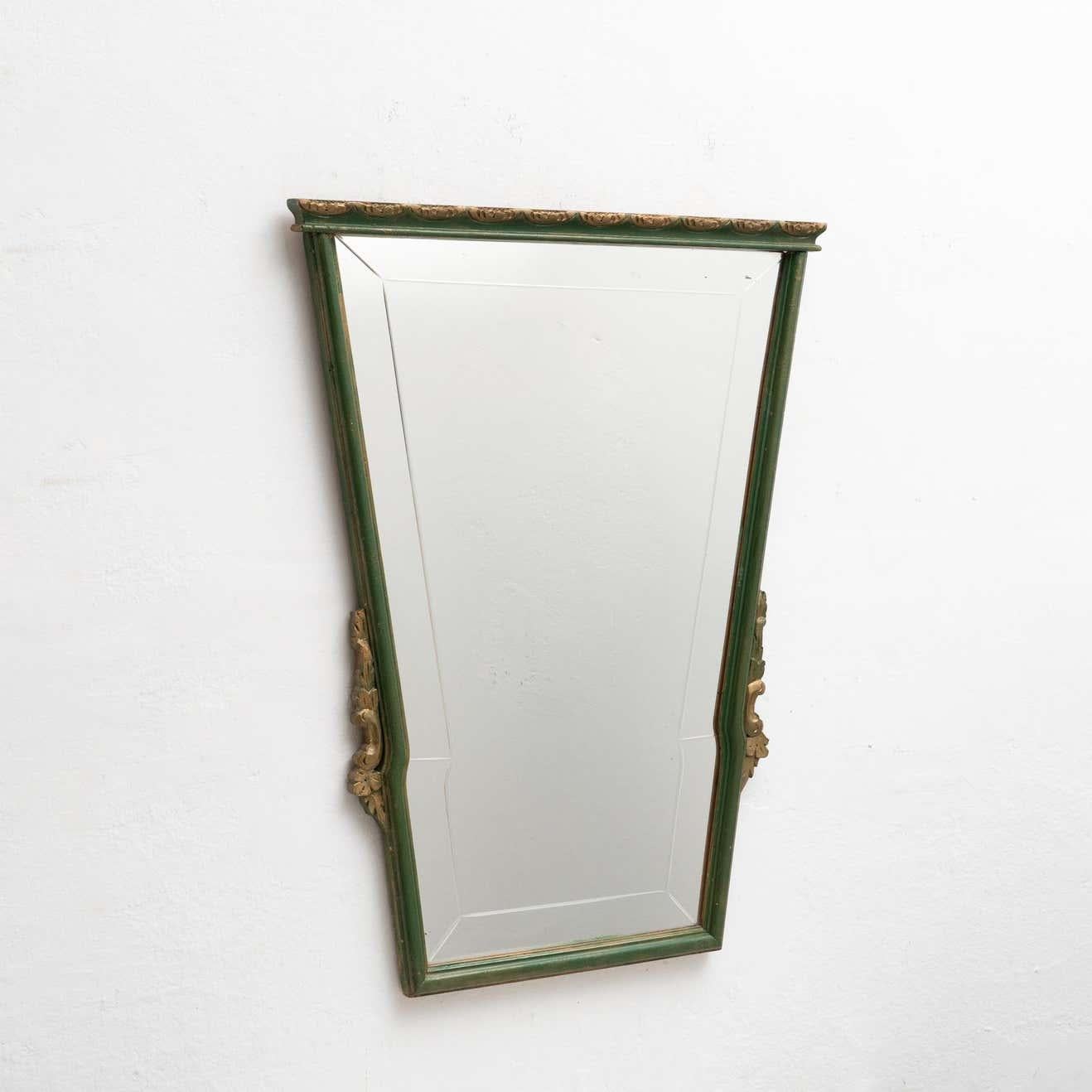 Antique Spanish handcrafted wooden mirror.

Manufactured by unknown designer in Spain, circa 1940

In original condition, with minor wear consistent of age and use, preserving a beautiful patina.

Materials:
Mirror.
Wood.
