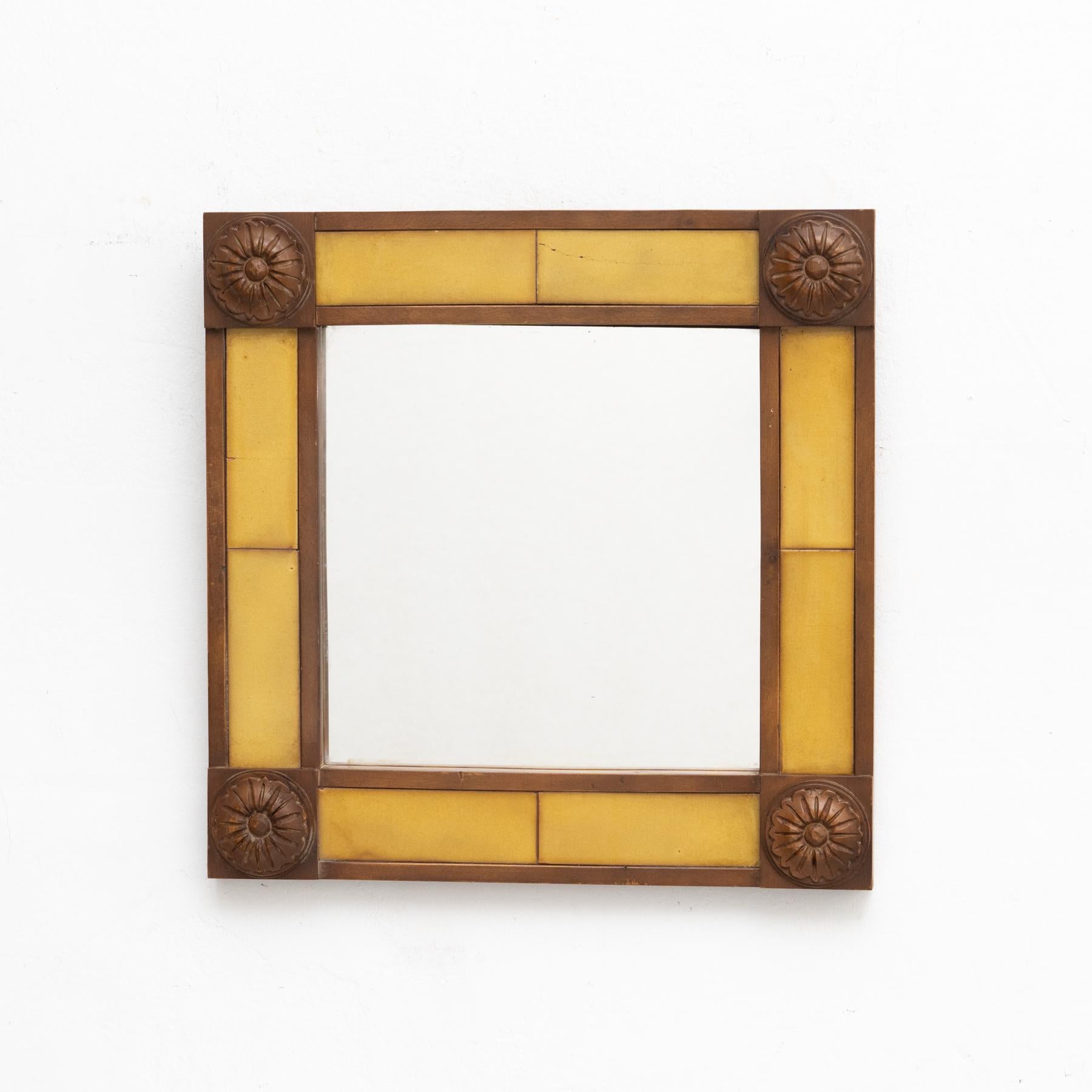 Antique Spanish handcrafted hand carved wood and tile mirror.

Manufactured by unknown designer in Spain, circa 1940

In original condition, with minor wear consistent of age and use, preserving a beautiful