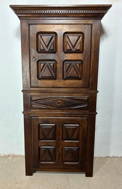 Early 20th Century Spanish Renaissance Style Walnut Cabinet with Geometric Carve