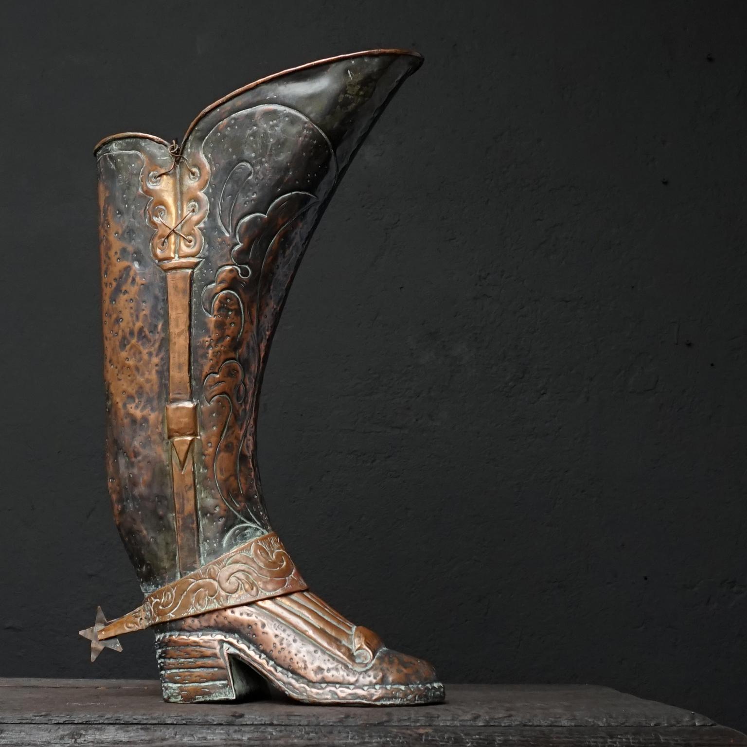 A heavy robust larger than life Spanish 1920s repoussé copper boot umbrella or walking cane stand. 
Very elegant way to collect all loose hockey sticks, canes and umbrellas in your entrance hallway.

Handcrafted and hammered in Spain featuring