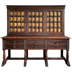 Early 20th Century Tudor Revival Cabinet with Gold Leaf Paneled Doors
