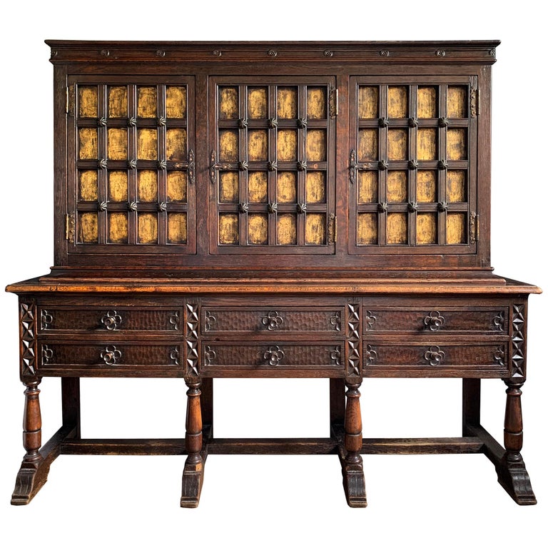 Tudor-revival cabinet with gold-leaf paneled doors, early 20th century, offered by RIGHT | PROPER
