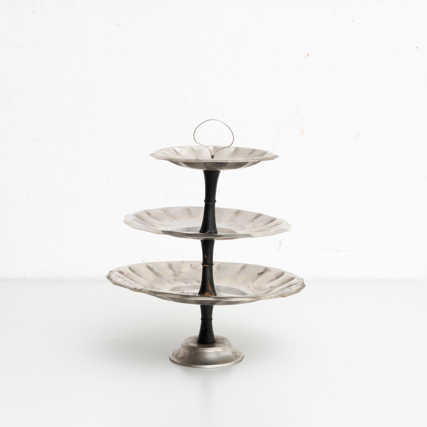 Three tier metal dessert plate from France.

Made by unknown manufacturer, early 20th century.

In original condition, with minor wear consistent with age and use, preserving a beautiful patina.

Material:
Metal.
 
