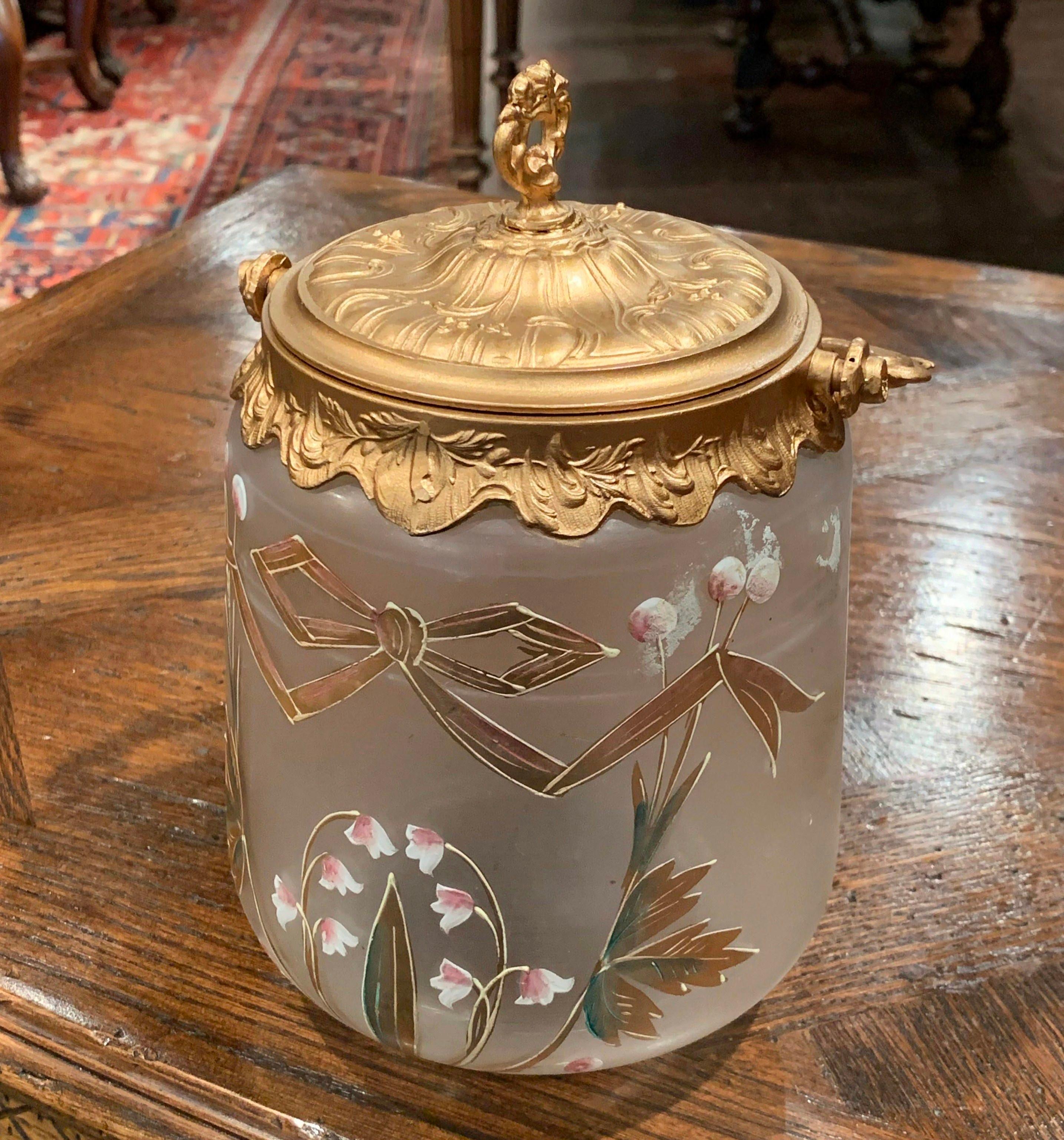 Decorate a kitchen or bathroom counter with this antique bonbonniere. Crafted in France circa 1920, the versatile jar has a metal top that's embellished with an ornate handle. The jar has a frosted glass decorated with traditional, hand painted