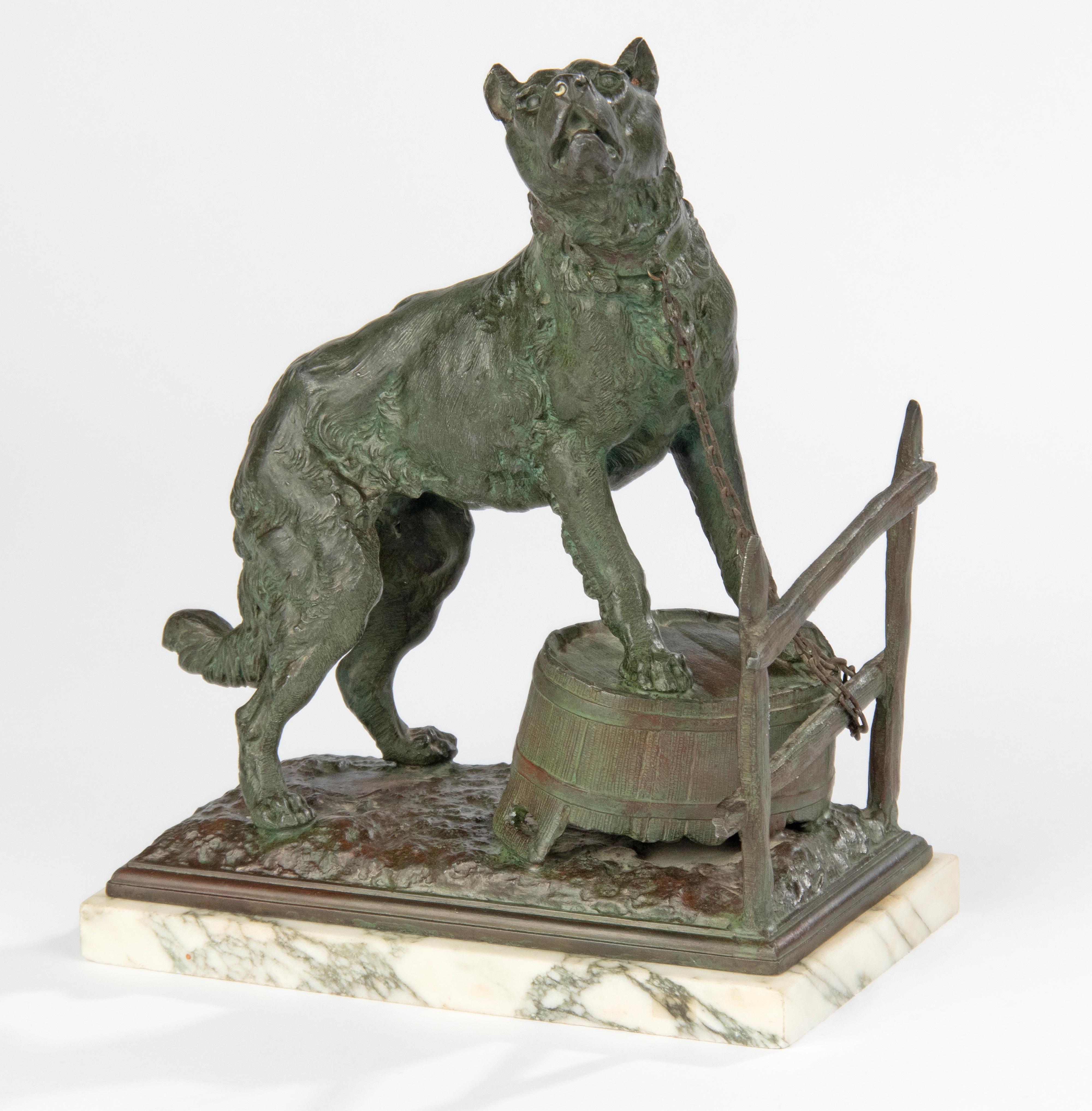 An antique sculpture (zink alloy) of a guard dog - a Staffordshire Terrier or Bandog type - guarding the property of its owner behind a wooden fence on a washing tub. The sculpture is made of green patinated zamac. On a green marble base. The