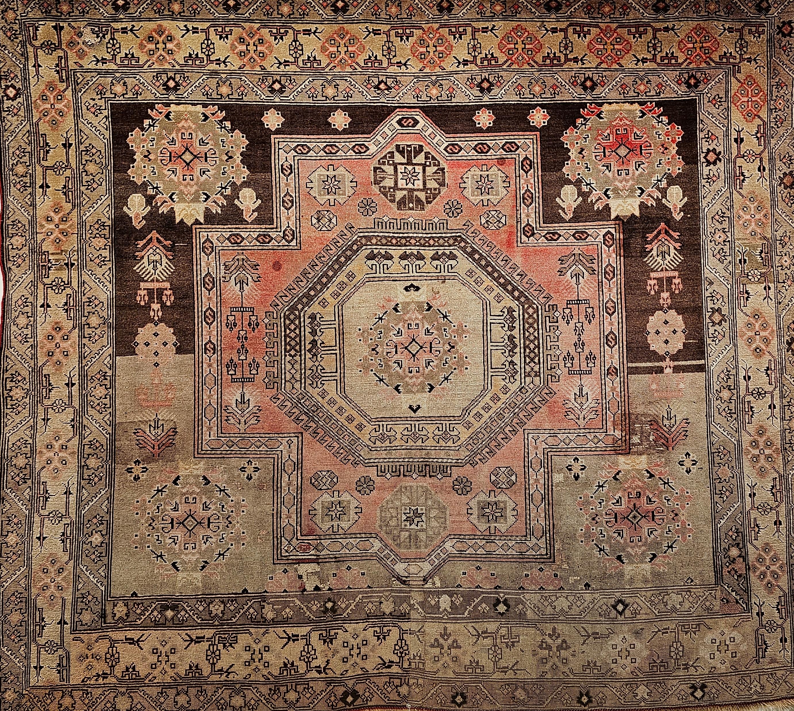Early 20th century Turkish Oushak in a near square size which is rare and very desirable.  The rug has a medallion geometric design similar to the famous 18th century Mamluk rugs from the Ottoman period in a field of Tan and Chocolate colors.  The