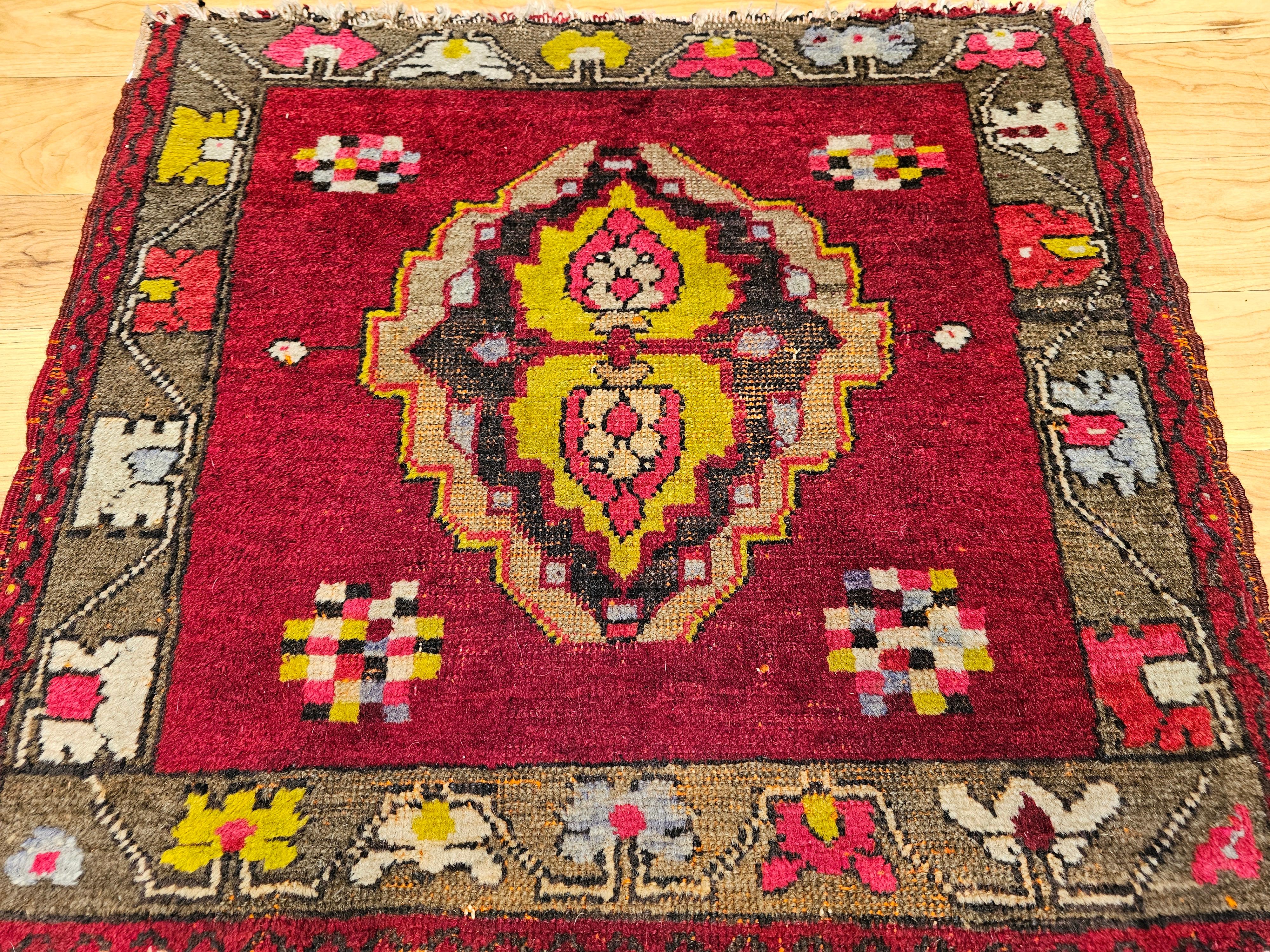 Early 20th century Turkish Oushak in a near square size which is rare and very desirable.  The rug has a large medallion design in the center and small square forms on each corner. The center medallion is contained in a red background with the