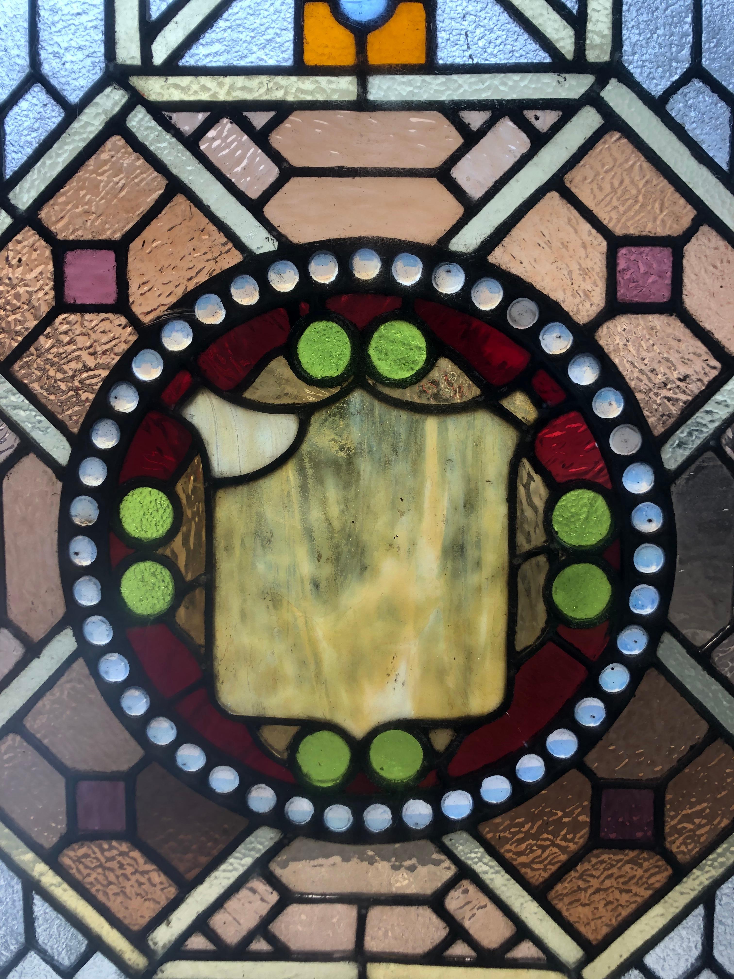 Early 20th Century Stained Glass Window in a Wood Frame For Sale 6