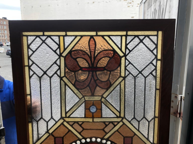 Early 20th Century Stained Glass Window in a Wood Frame For Sale at