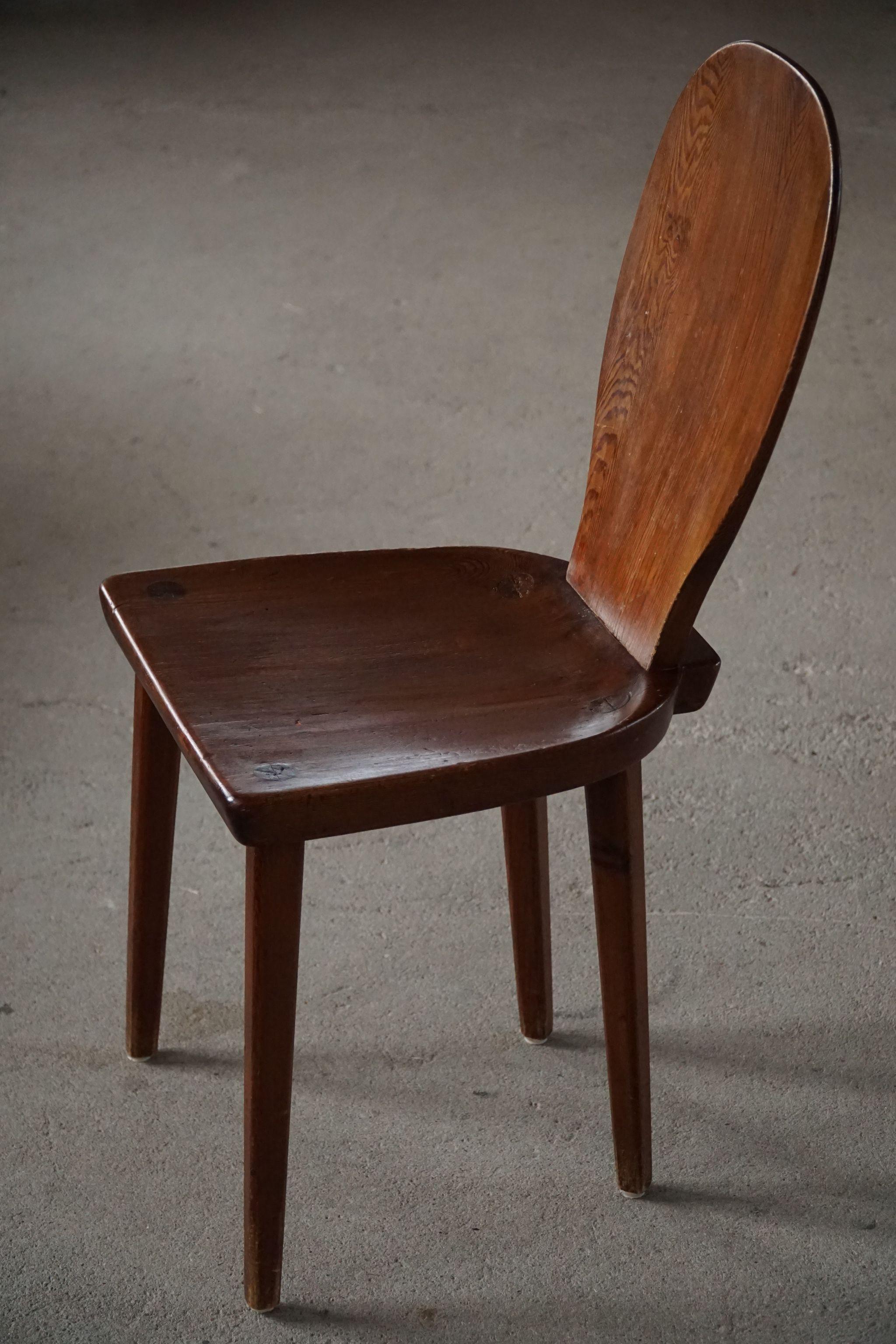 A rare dining / office chair in stained pine. Designed by Carl Malmsten in 1930s. Model 