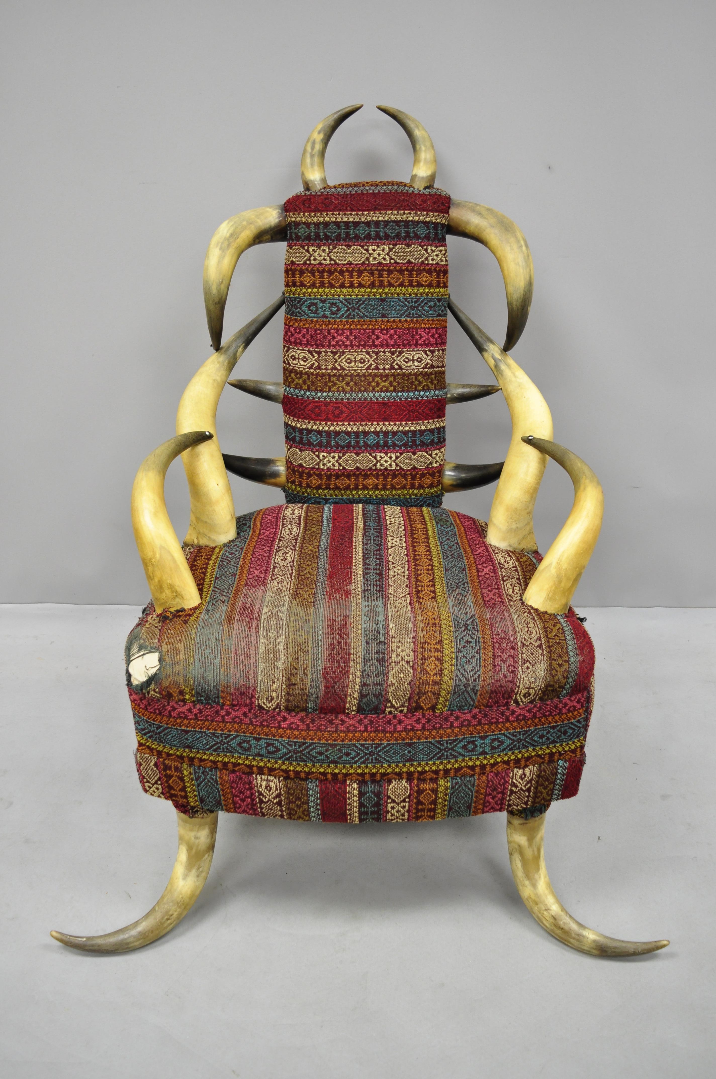 Early 20th century steer Horn parlor chair. Item features steer Horn frame, burgundy and blue upholstery, desirable size and form, circa early 20th century. Measurements: 41