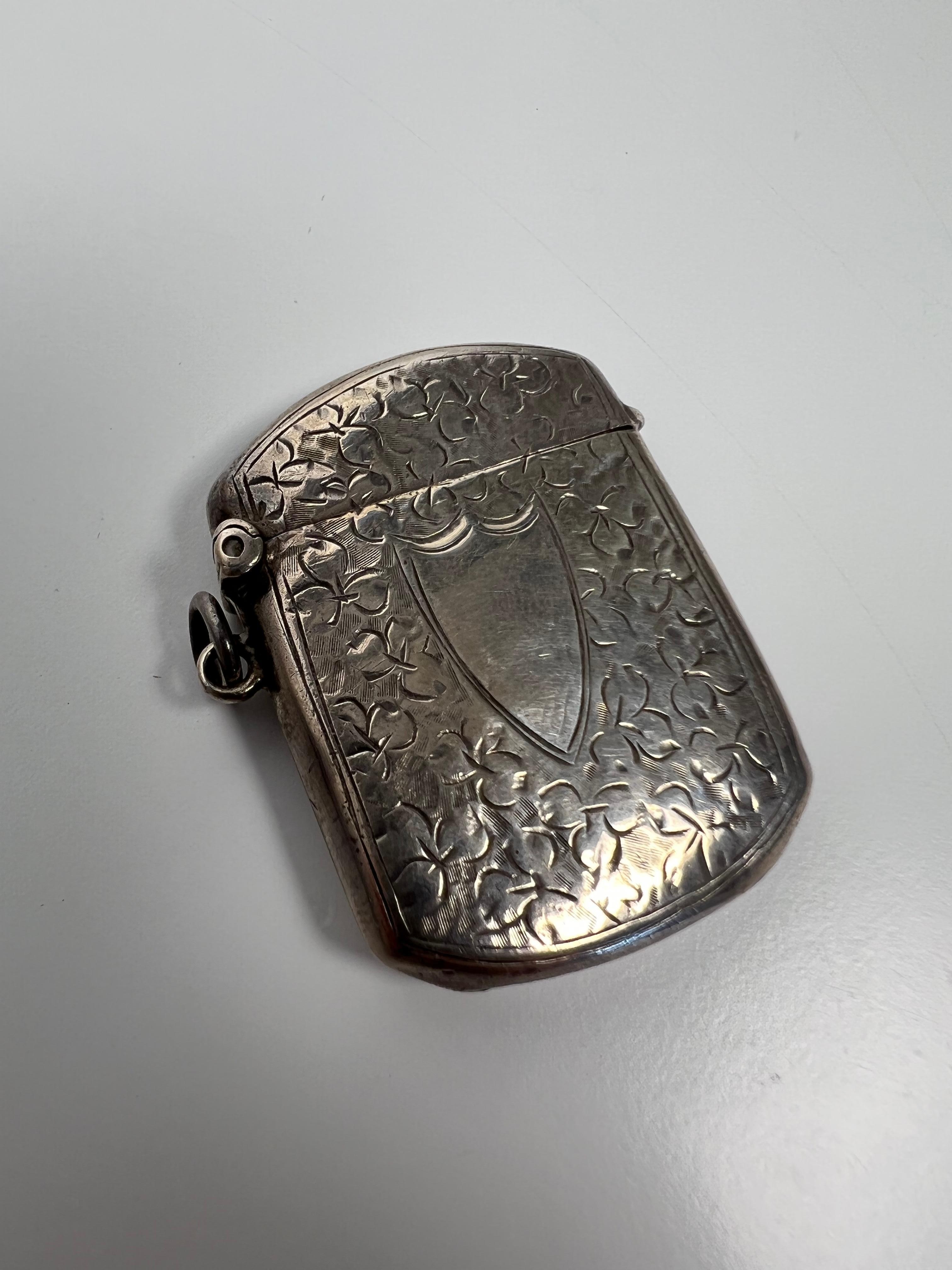 Early 20th century sterling silver match safe with beautiful repousse sides made by WSH Birmingham England. The silversmiths mark WSH is by William Henry Sparrow - H Williamson Ltd. This is a nice piece from a collector who traveled the world buying
