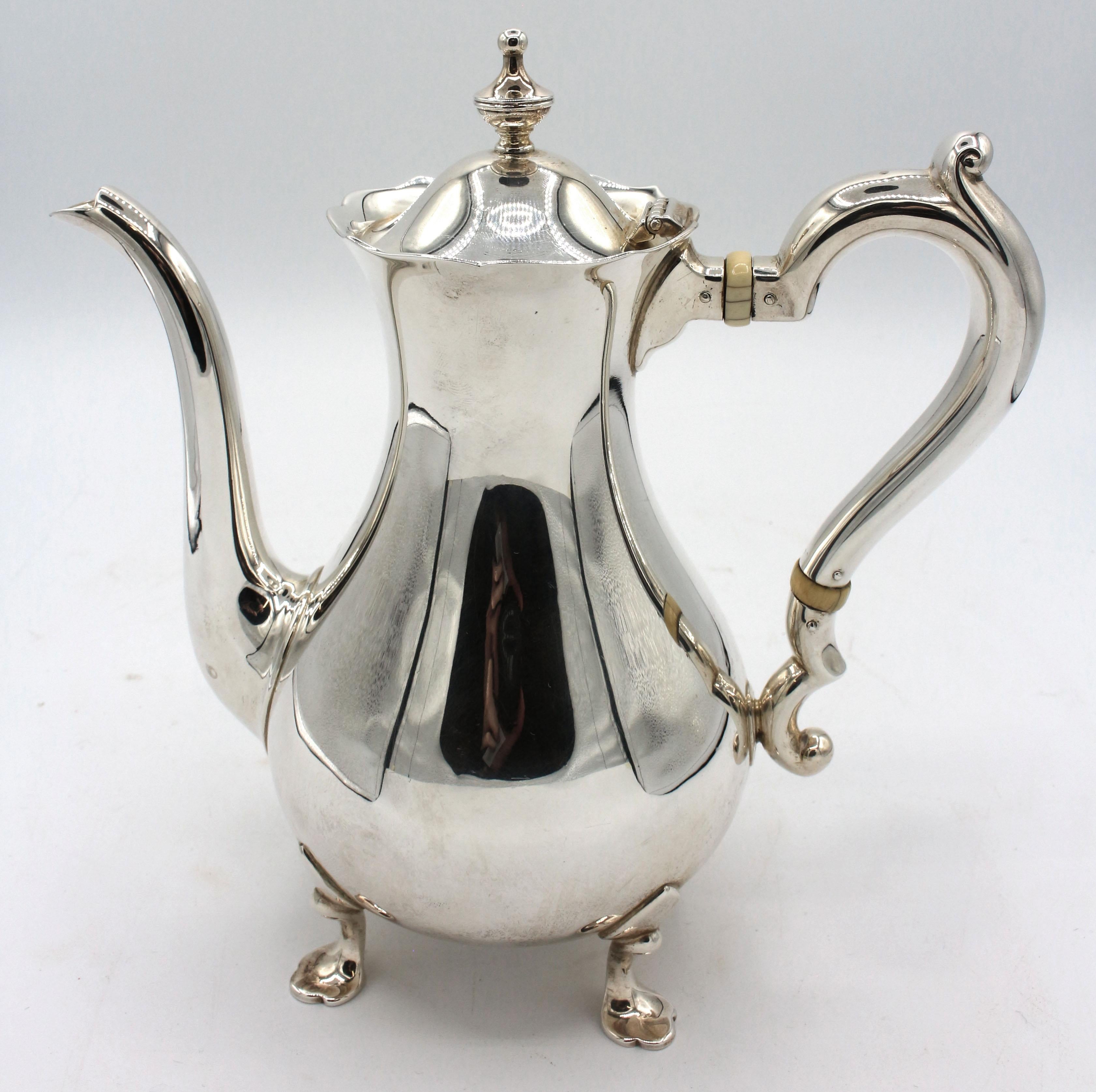 Sterling silver demitasse pot by Gorham, early 20th century. Georgian taste raised on 4 trifid feet. One dimple on side. 1 1/2 pint capacity. 15.90 troy oz.
7.75