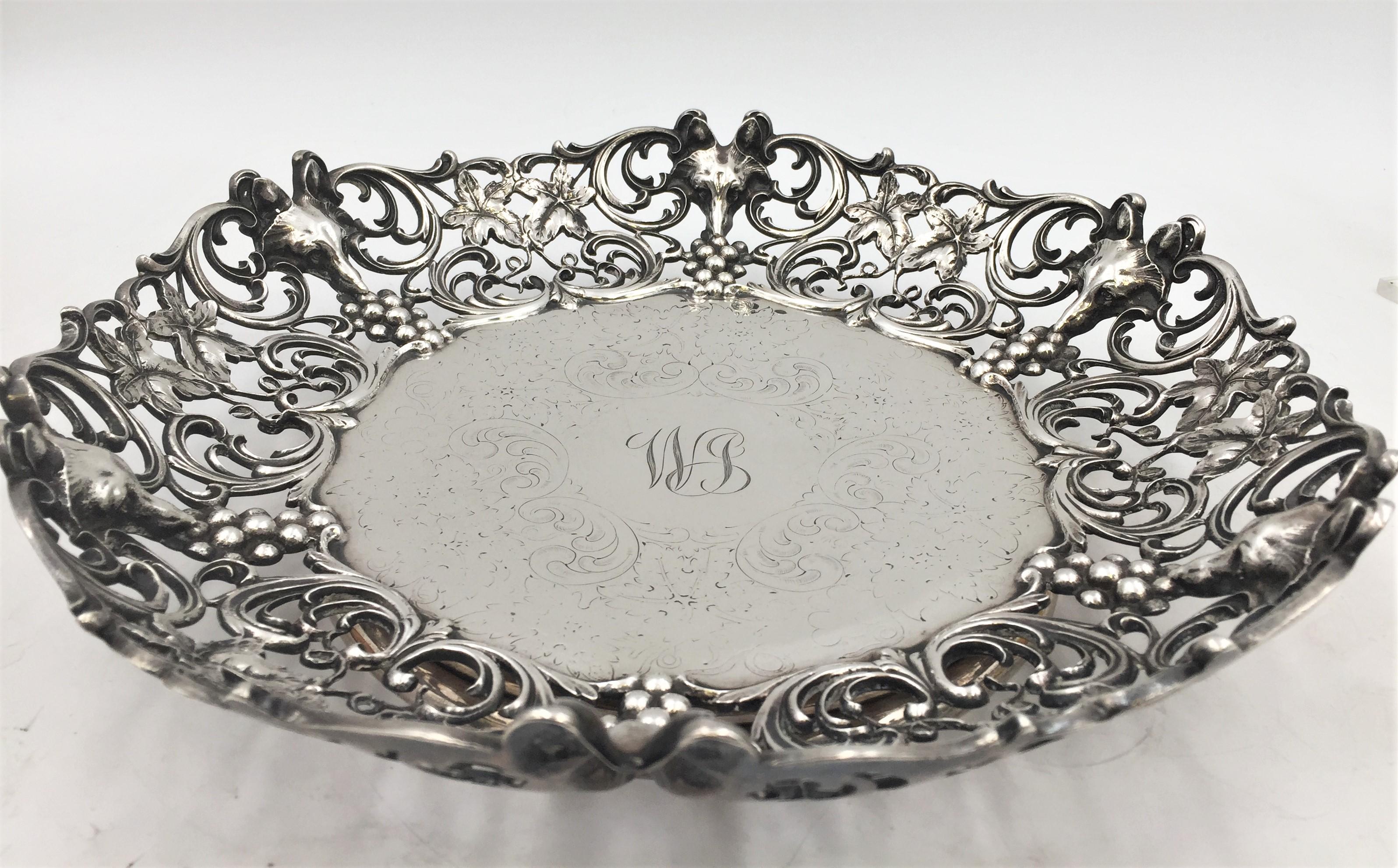 Early 20th century sterling silver bowl designed by Roger Williams, retailed by Spaulding Co. Designed with scrolls, foxes' head around rim, and grape clusters and grape leaves. Measuring 11 3/4 inches in diameter, weighing 33.65 troy ounces.