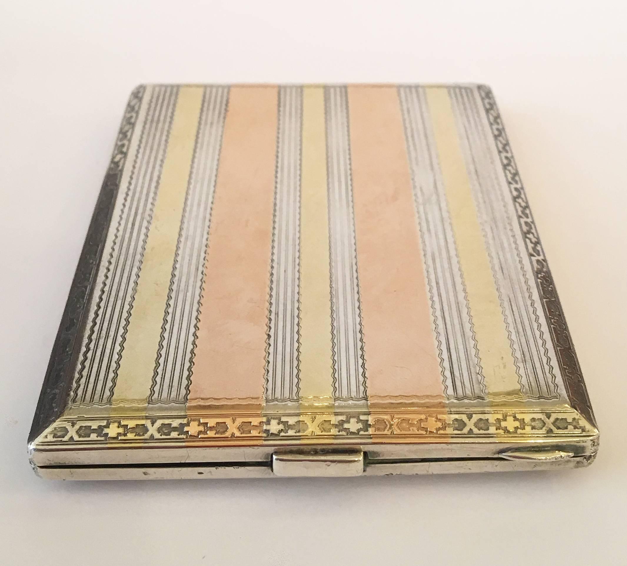 This early 20th century sterling silver Hermès cigarette box can also be used as a modern day business card holder. The case is sterling silver with gold and rose gold inlay. Marked 
