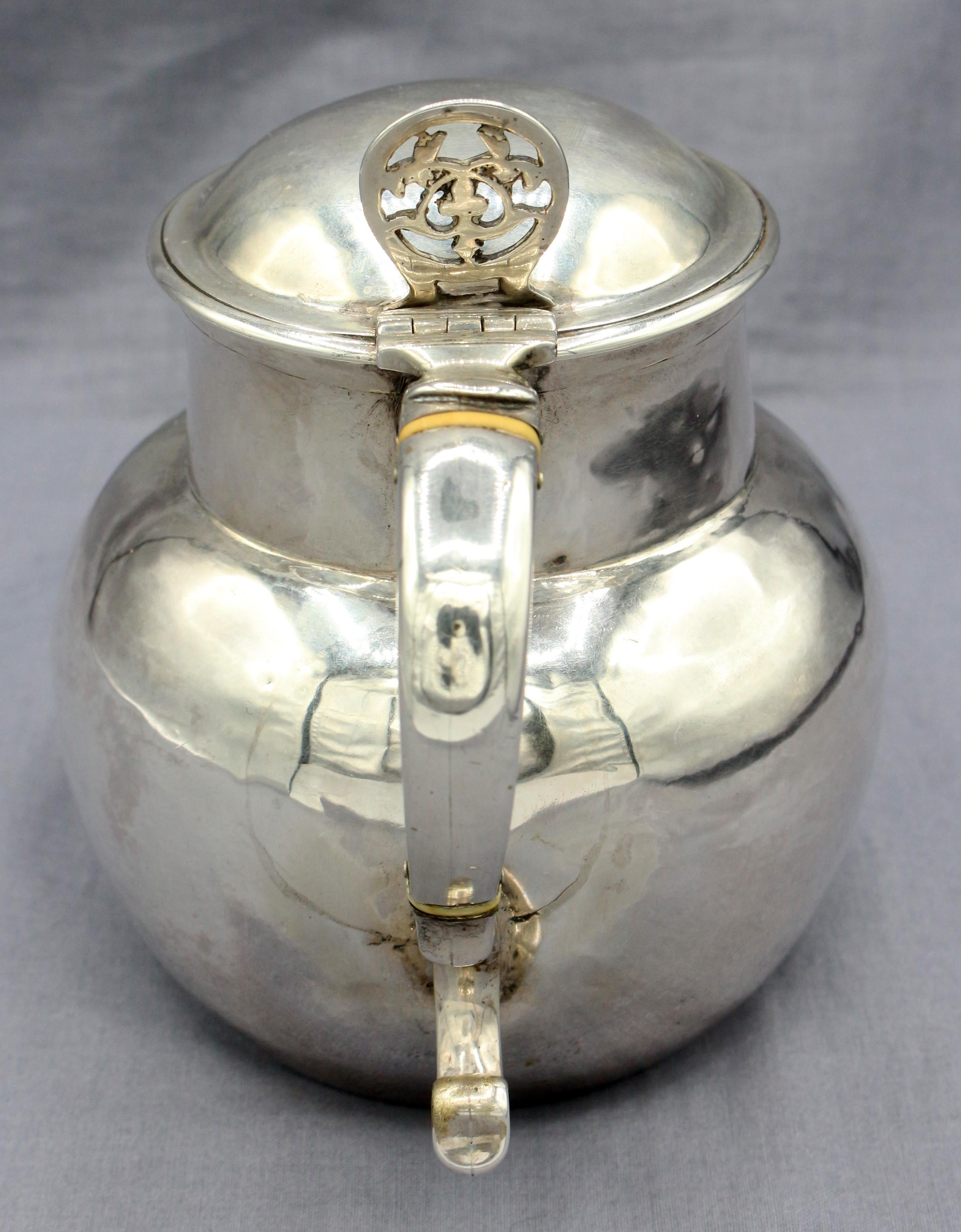 Sterling silver flip-top jug, London, body 1724(?) & flip-top early 20th century. Bone insulators. 11.65 troy oz.
5.75
