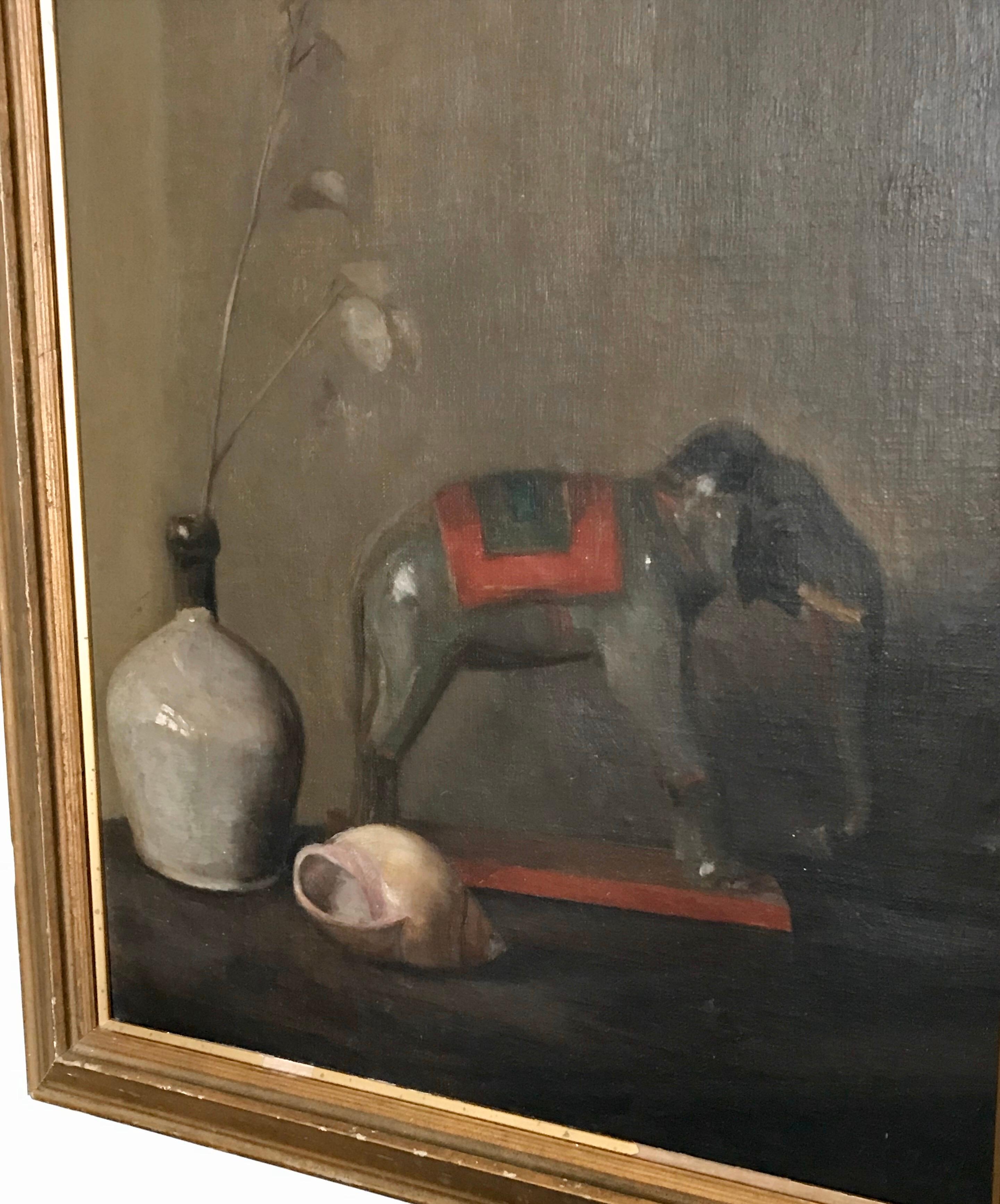 Well executed oil on board still life painting of a toy elephant on a table. Early 20th century by FC Bond, 1927.