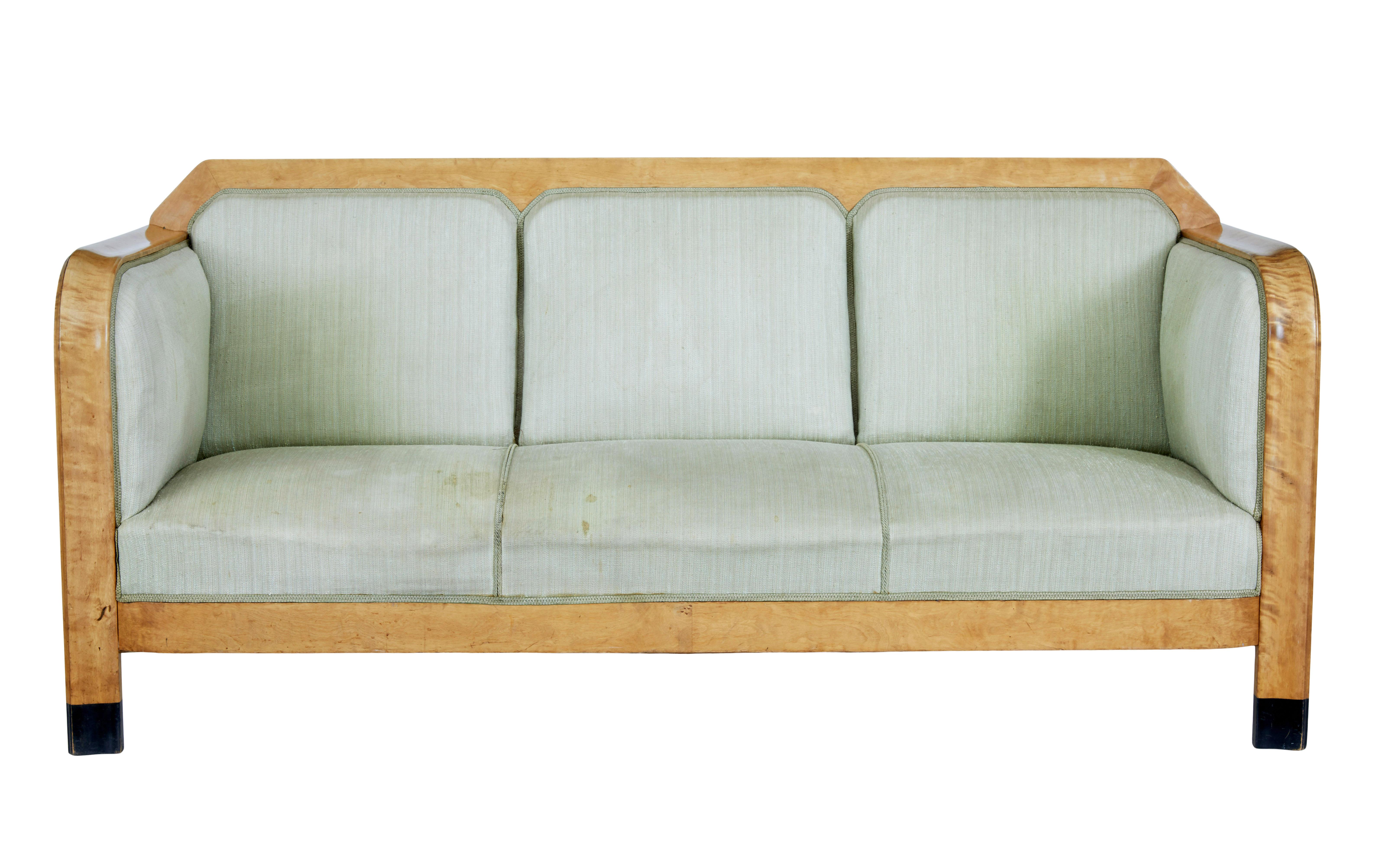 Early 20th century Swedish birch sofa circa 1900.

Large proportioned comfortable 3 seater sofa.  Flowing arms with straight solid sides.  Upholstery shaped to form 3 seats.  Ebonised tips to from legs.

Very comfortable sofa, which is need of