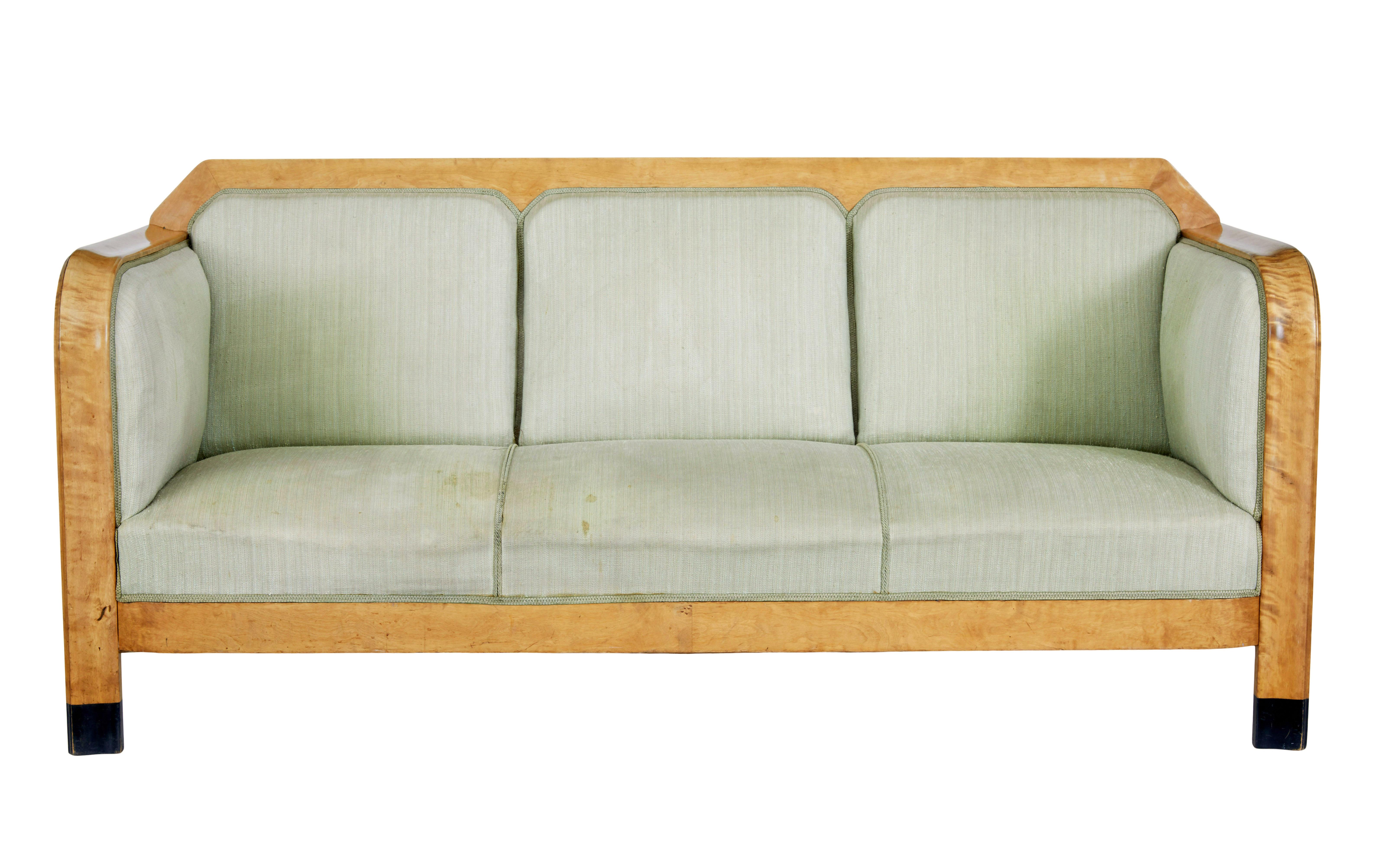 Early 20th century swedish birch sofa, circa 1900.

Large proportioned comfortable 3 seater sofa. Flowing arms with straight solid sides. Upholstery shaped to form 3 seats.  Ebonised tips to from legs.

Very comfortable sofa, which is need of