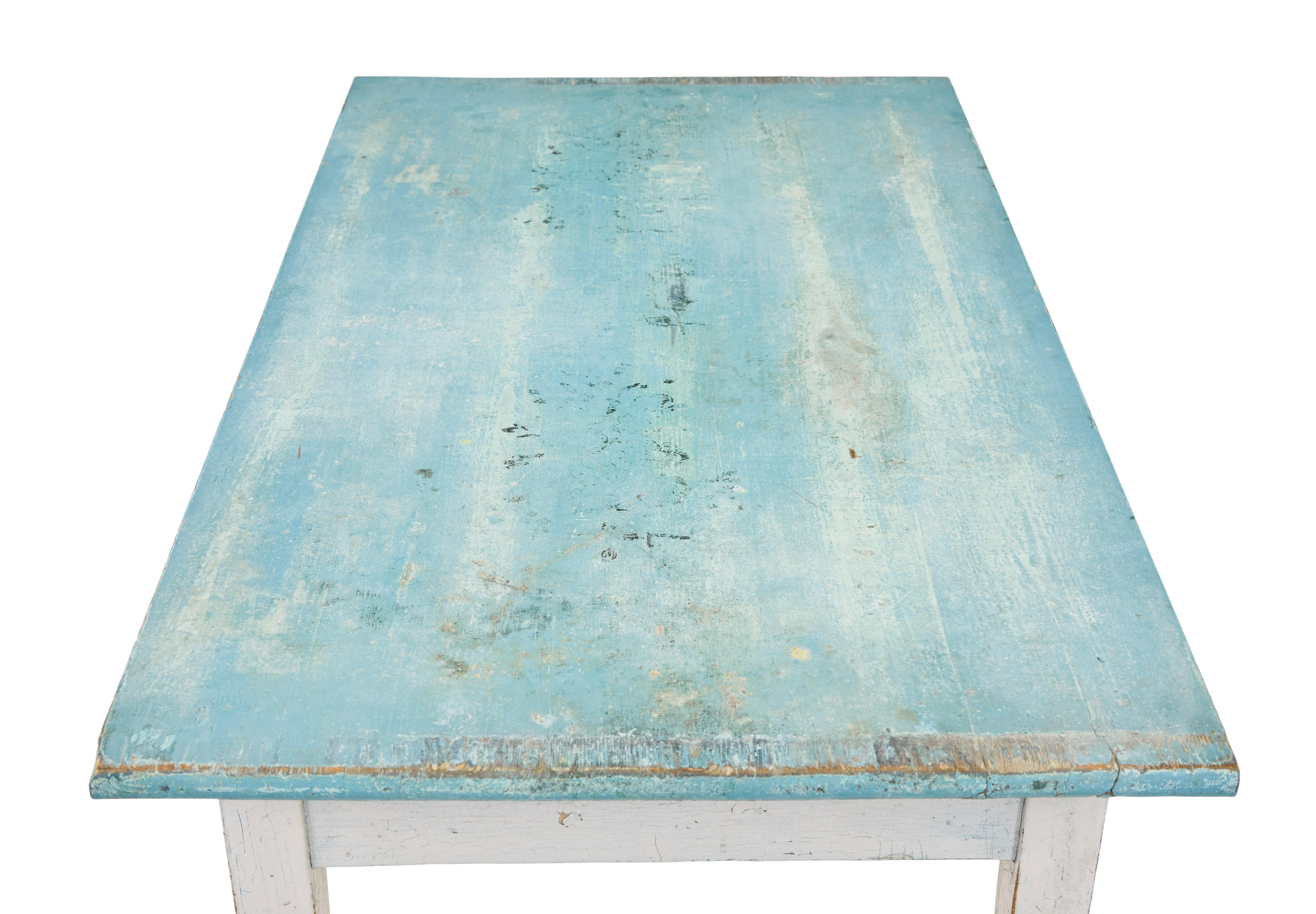 Rustic Swedish side table circa 1910.

Over-sailing painted pine top, supported by a contrasting light grey base, raised on 4 tapering legs.  Ideal for use in the hallway or maybe the garden room.

Obvious scrapes and marks to top, evidence of holes