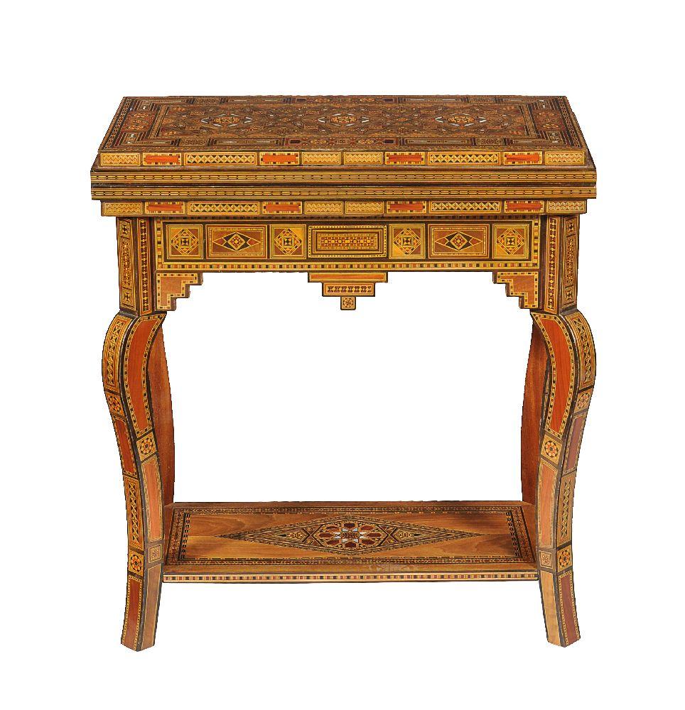 This profusely inlaid Syrian games table dates from the early 20th century, and it has multiple geometric and asymmetric inlays of various woods and mother of pearl.

The hinged lid opens to reveal a similarly inlaid interior and a removable