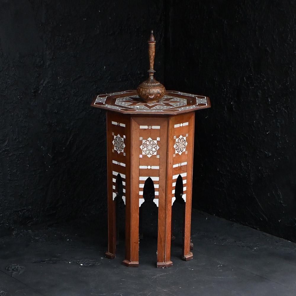 Early 20th century Syrian side table 

A brilliant example of an early 20th century inlaid Syrian side table. Covered in geometric natural pearl detail. Perfect for that added piece of eastern style in any well-dressed interior space. 

Dimensions