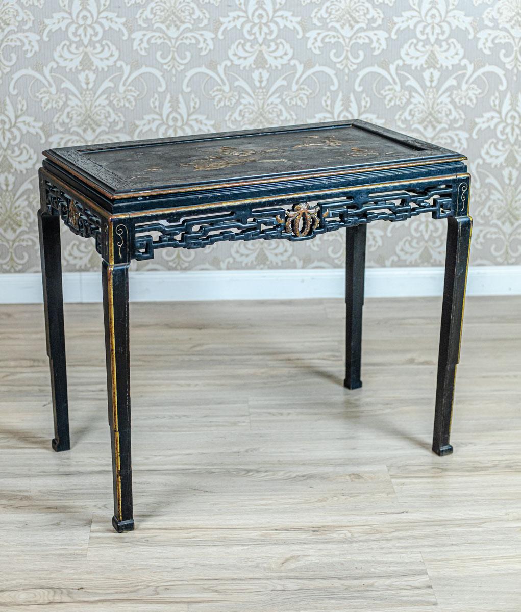 We present you a table from the early 20th century.
The top is decorated with a semi-plastic landscape originally glass-topped.
The apron is all in openwork carvings.

This piece of furniture is in original condition.
However, the black